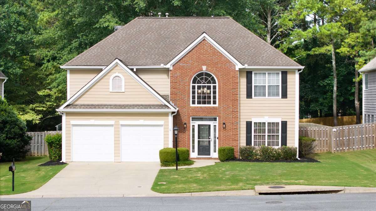 Nestled in the highly desirable East Worthington swim/tennis community in East Cobb. Located just minutes from I-75, this home offers effortless access to Marietta Square, The Battery, and Downtown Atlanta, while still enjoying the comfort and quiet of a well-maintained neighborhood. With sidewalks, streetlights, a large community pool, lighted tennis and pickleball courts, and a playground, this community is ideal for those seeking both convenience and connection. Inside, this freshly painted 4-bedroom, 2.5-bath home offers a functional and flexible layout. The two-story foyer welcomes you into a bright and open main level featuring a separate living room and formal dining room - perfect for entertaining. The kitchen boasts beautifully stained cabinetry, granite countertops, stainless steel appliances, recessed lighting, and a breakfast area that opens into the cozy family room with built-in shelving and a fireplace. Upstairs, the expansive primary suite includes a tray ceiling, large walk-in closet, and a spacious en-suite bath with vaulted ceilings, a soaking tub, double vanities, and a separate shower. Three additional generously sized bedrooms, all with hardwood flooring, a full bath, and a spacious laundry room with storage complete the upper level. Step outside to discover one of this home's true highlights - a sprawling, fully fenced backyard offering privacy, space, and endless potential. Whether you're hosting summer cookouts on the oversized deck, creating a play space, planting a garden, or even adding a future pool, this yard is your blank canvas. With fresh updates throughout, community amenities just steps away, and walkable access to everyday essentials like Publix, this home delivers East Cobb convenience without compromising on charm or space!