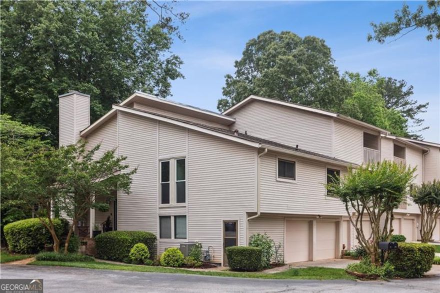 Welcome to this spacious and versatile end-unit townhome in the desirable Indian Hills Country Club community of East Cobb. Featuring a unique half-level split floor plan, this home offers the feel of a single-family residence with just a few steps between levels-providing both comfort and convenience. A dramatic two-story foyer welcomes you in, with access to the main living area or down to a cozy family room with a fireplace. Adjacent to the family room is an open flexible space next to a full bathroom-could be enclosed to create a guest suite, home office, or fourth bedroom. The lower level also opens to a large screened-in porch, ideal for relaxing or entertaining year-round. The main level includes a two-story dining room and an eat-in kitchen with ample cabinet and counter space, a pantry or utility closet, and a built-in desk area. The primary suite on this level features a walk-in closet and a private bath with a separate vanity area. Upstairs, two additional bedrooms and a full bath offer excellent separation and privacy. Enjoy fantastic outdoor living with a charming covered front porch, screened back porch, and a small private yard. Just steps away from the golf course, with easy access to the July 4th fireworks and all the amenities of Indian Hills Country Club, this home is ideally positioned on a flat cul-de-sac with guest parking and minimal traffic. Conveniently located near Wellstar and Northside medical parks, The Avenue, East Cobb Park, Target, Trader Joe's, Publix, and much more. It's also walkable to East Side Elementary and zoned for the highly rated Dickerson Middle, and nationally ranked Walton High School.
