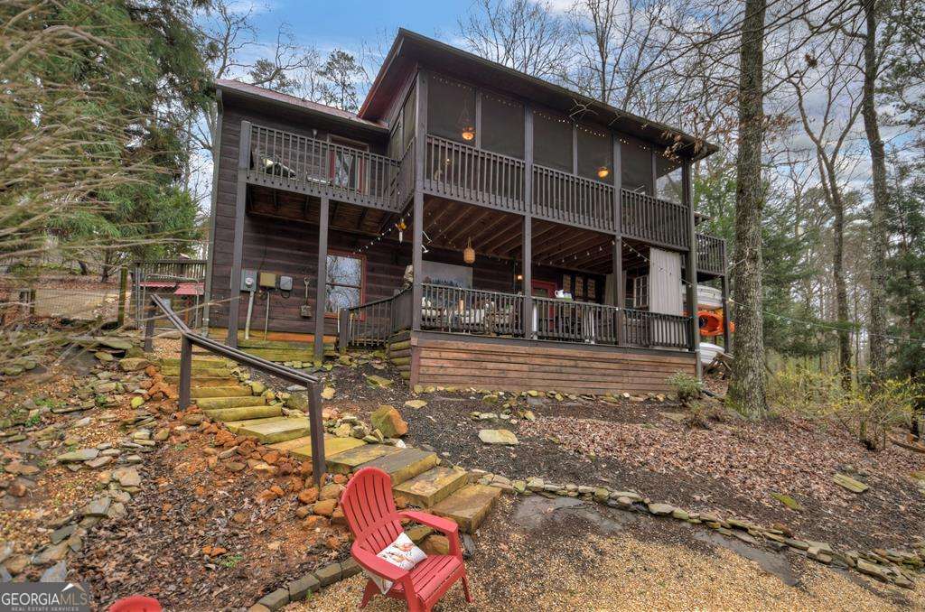 Find Your Flow in the Mountains-Imagine coming home to the soothing sounds and serenity of nature. This spacious home offers more than just a place to live-it's a sanctuary where comfort and nature come together in harmony. The main level welcomes you with TWO owner's suites and an open living space where thoughtful design and natural elements create a sense of calm and flow. The kitchen adds its own touch of creativity with granite counters, stainless appliances, and a striking river rock backsplash that feels inspired by the mountains themselves. On the terrace level, you'll discover a private guest suite, flex/office space, and generous storage-perfect for creating balance between work, rest, and play. Step outside to enjoy a fenced backyard, oversized garage with workshop space, and all the amenities of this gated resort community, including pools, tennis, and a clubhouse. Whether you're seeking a full-time residence, a peaceful getaway, or an investment property, this home invites you to embrace the ease and serenity of mountain living.