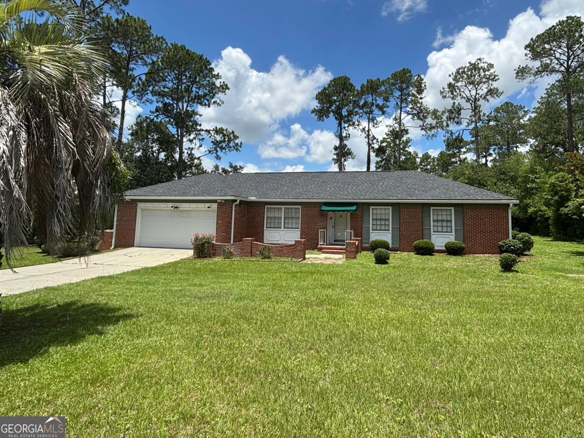 Welcome to this timeless brick ranch-style home in one of Tifton's central neighborhoods! Featuring 3 bedrooms, 2 full bathrooms, and nearly 1,800 square feet of living space, this property is full of charm. Step inside to a cozy kitchen with custom cabinetry, a breakfast bar, and updated appliances. Natural light fills each room, and the thoughtful layout offers both comfort and functionality. The living spaces are move-in ready, with classic finishes and great potential for personal touches. Outside, you'll love the lush lawn, brick-accented front entry, and especially the in-ground pool - perfect for summer relaxation or entertaining. This is a rare find with a pool in a prime Tifton location!