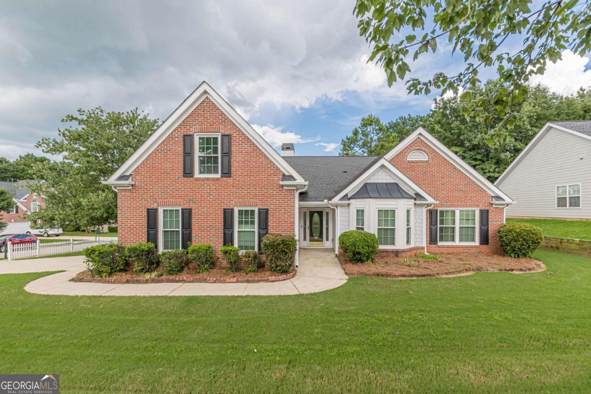All-Brick 3-Bedroom Ranch with Bonus Room in Swim/Tennis Community! This beautifully maintained 3-bedroom, 2-bathroom ranch with a bonus room offers the perfect blend of comfort, style, and amenities-just minutes from schools and shopping. Situated on a level corner lot in a sought-after swim/tennis community, this home features 4-sides brick construction and a 2-car garage for lasting quality and curb appeal. Inside, hardwood floors flow through the main living areas, including a formal dining room and a fireside family room. The spacious kitchen boasts tile floors, a center island, stainless steel appliances, a convenient desk area, and ample cabinet storage-all with an open view to the family room for easy entertaining. The oversized primary suite on the main level features a vaulted ceiling, hardwood floors, and a sitting room. The en suite bath offers double vanities, a tile floor, soaking tub, and separate shower. A finished bonus room over the garage provides flexible space for an office, guest room, or playroom. Step outside to enjoy the extended back patio-perfect for gatherings or quiet evenings. Neighborhood amenities include a pool, tennis courts, pickleball courts, and a playground. Move-in ready and loaded with charm, this home has it all!