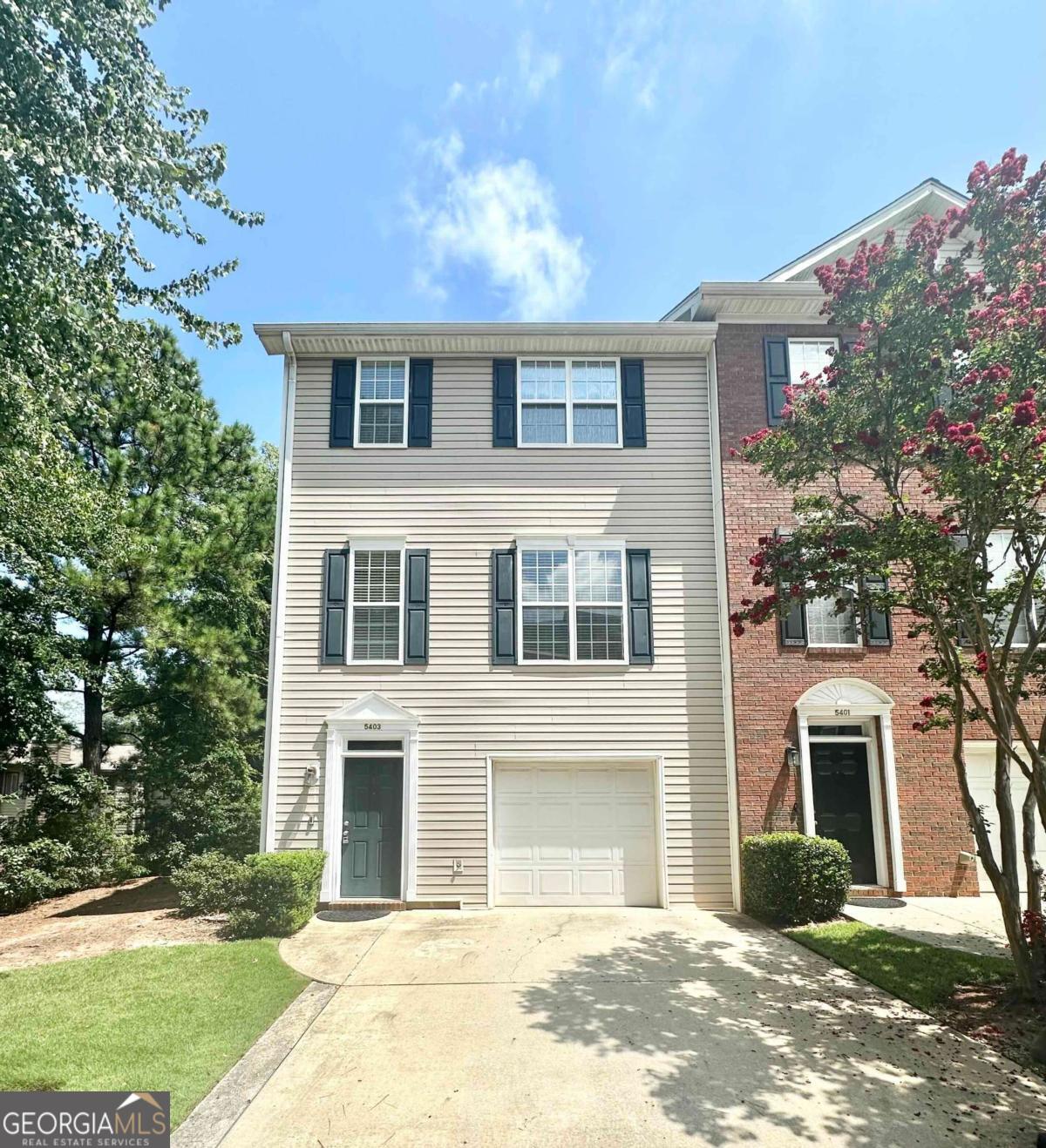 Sought after end-unit! This lovely well-maintained townhome has everything you need to call your new home! Nestled in a quiet neighborhood in the heart of Norcross, it is perfectly located just off Beaver Ruin Road, offering easy access to I-85, Peachtree Industrial Blvd, and Jimmy Carter Blvd. Lower Level boasts a welcoming foyer, a one-car garage, a powder room, a laundry room, and a large bonus room that can be customized as a guest bedroom, office, gym, or library. The main level features a spacious family room, an open-concept eat-in kitchen with views to the family room, a powder room, and a deck. Upper level completes the home with one master suite and two guest bedrooms. Newer HVAC and refrigerator. Affordable HOA covers lawn care and exterior maintenance, making this home a low-maintenance gem. In addition to the garage, the driveway offers parking for two cars, and there's plenty of guest parking available nearby within the community.