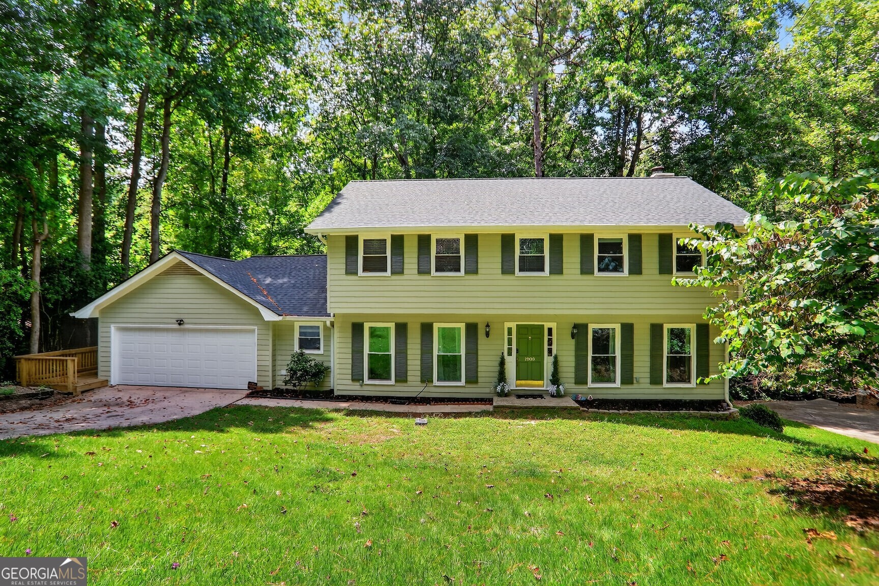 Welcome to your dream home in the highly sought-after Martin's Landing community! This 4-bedroom, 3.5-bath residence offers exceptional living space, modern upgrades, and timeless charm. Step inside to find a separate dining room, a fully renovated kitchen featuring a farmhouse sink, ceiling-mounted vent hood, kitchen island and a cozy breakfast area. The spacious layout includes a large sitting area or office, and a family room with built-in bookshelves, perfect for relaxing or entertaining. Enjoy the natural light in the expansive sunroom, boasting elevated ceilings and walls of windows. Step outside to a brand-new, multi-level deck that wraps around to the front of the home ideal for outdoor gatherings and serene mornings. The finished basement includes a full bathroom and walkout access to the lower deck, offering great potential for a guest suite, media room, or home gym. Additional highlights include brand New roof. Nestled along the scenic Chattahoochee River, Martin's Landing offers an unparalleled lifestyle in the heart of nature. As a resident, you'll enjoy access to three sparkling swimming pools, 13 tennis courts including two premium clay courts and six pickleball courts, perfect for active living. Explore miles of picturesque walking trails, or spend your afternoons kayaking and fishing on the private community lake
