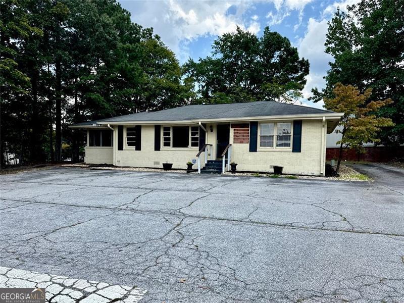 Welcome to 5464 Five Forks Trickum Road! This is the lease deal you have been waiting for. LOCATION, LOCATION, LOCATION! Wonderfully located on the busy Five Forks Trickum Road right near the intersection, this location markets any business on its own. Perfect space for any office, medical practice, insurance agent, chiropractic care, light retail, and much more. Ample parking space for customers, as well as a open entrance for easy access. Inside you get 1,347 square feet of usable space, with a front reception/ waiting area, multiple rooms inside for multi purpose, a kitchen area, and a bathroom. Additionally, there is more space out back for any extra storage or expansion needs. Remarkable location at an unbeatable price. 24 and 36 month lease options available.