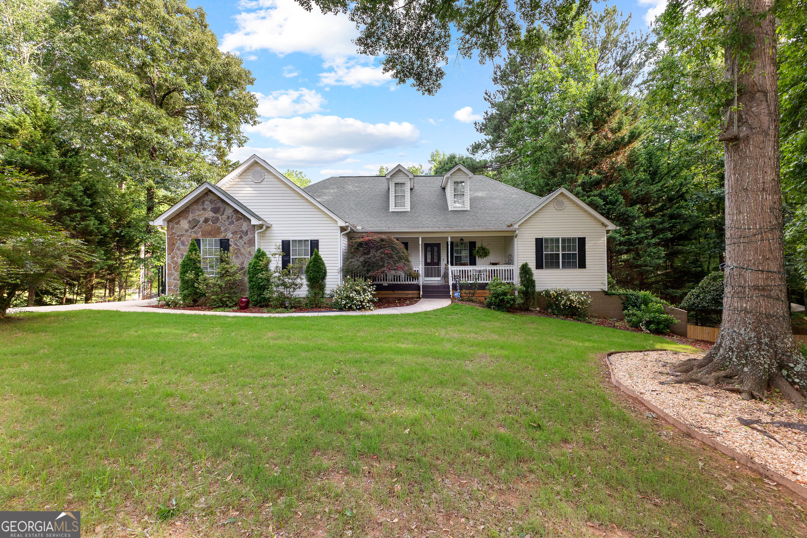Welcome to your private retreat in Newnan! Nestled on 2.74 serene acres, this spacious 4-bedroom, 2-bathroom home offers the perfect blend of comfort, functionality, and outdoor enjoyment. The main level features an open, inviting layout with a well-appointed kitchen-ideal for everyday living and entertaining. Step outside to a large deck overlooking the backyard that features a creek, perfect for morning coffee or evening relaxation. Downstairs, the fully finished basement adds valuable living space for a media room, gym, or guest area. Enjoy summer days in the above-ground pool spa, complete with a patio area for lounging and gatherings. A peaceful creek runs along the back of the property, creating a beautiful natural backdrop. With room to roam and space to grow, this property offers a rare combination of privacy and convenience-don't miss it!