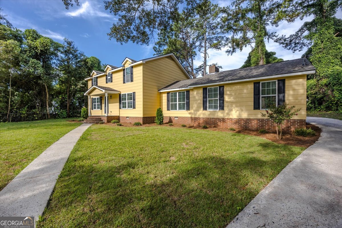 Welcome to this beautifully updated five-bedroom, two-bath home in the heart of Perry, Georgia - a town well known for its Southern hospitality and the Georgia National Fair. This home has been thoughtfully renovated from top to bottom, making it move-in ready for its next family. Inside, you'll find brand-new LVP flooring that runs throughout the entire home, giving it a clean and modern feel. The kitchen has been completely remodeled with new cabinets, granite countertops, and stainless steel appliances, creating a space that's both functional and stylish. Both bathrooms have also been redone, one featuring a sleek walk-in tile shower and the other a tub with a beautiful tile surround. The upgrades continue with all-new windows, fresh paint, new light fixtures and hardware, and a new water heater. Comfort is at the forefront with a brand-new roof, a new HVAC system supported by two new AC units, and the peace of mind that comes with knowing all major systems have been updated. Outside, the fresh landscaping highlights the yard, offering plenty of room for kids to play. With its spacious layout, modern updates, and prime location close to downtown Perry's shops, restaurants, and schools, this home offers the perfect blend of comfort and convenience for family living.