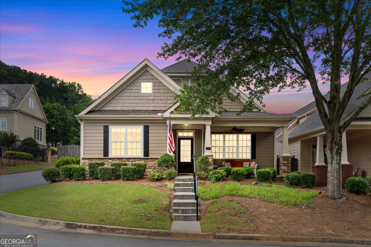 Luxury Living in The Glens at Mountain Brook! Experience the perfect blend of comfort, convenience, and community in this beautifully updated home located in the gated neighborhood of The Glens at Mountain Brook. This stepless-entry, single-level home offers 2 bedrooms, 2 baths, and a thoughtfully designed open floorplan filled with natural light. The spacious kitchen is a standout, featuring a huge walk-in pantry, a built-in desk area, updated appliances, counters, backsplash, and under-cabinet-lighting. The kitchen flows seamlessly into the dining area and light-filled great room-creating the perfect setting for everyday living and entertaining. Enjoy your morning coffee or wind down in the evenings in your private courtyard. The primary suite offers a peaceful retreat with an ensuite bath and double vanity. The secondary bedroom is generously sized to accommodate guests and/or a home office. The laundry area has been thoughtfully relocated to the garage, allowing for even more usable space inside the home. The attached 2-car garage offers additional room for hobbies or storage. Nearly every surface has been updated-paint, flooring, appliances, systems, light fixtures, backsplash, counters, HVAC, water heater, and roof-this home is truly move-in ready. Enjoy a low-maintenance lifestyle with HOA-covered exterior upkeep and access to resort-style amenities including a clubhouse, pool, gym, dog park, and walking trails. Ideally located just minutes from Downtown Woodstock, I-575, The Outlet Shoppes, Lifetime Fitness, Historic Roswell, and more. Senior school property tax exemption may apply for those 62+. Don't miss this beautifully upgraded home in one of Cherokee County's most desirable gated communities!