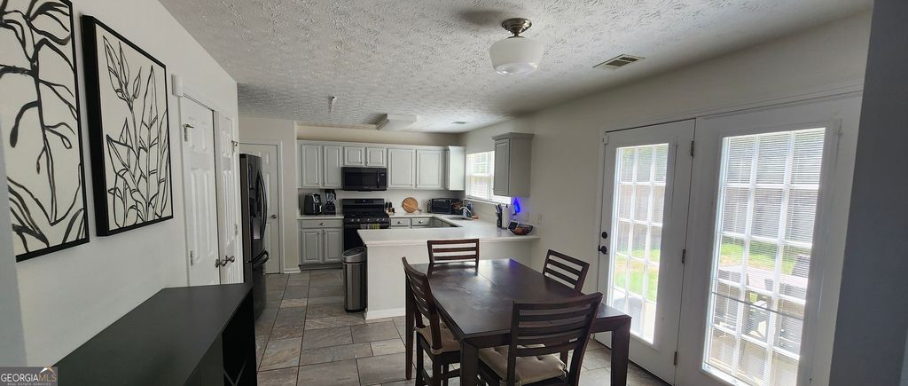 Photo of 863 Hawthorn Lane, Grayson, GA 30017 (MLS # 10736555)