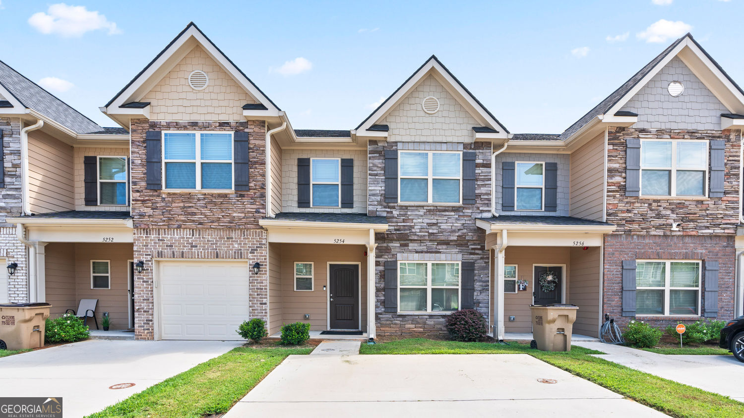 Built in 2022, this nearly new 3 bed / 2.5 bath townhome combines modern finishes with a prime location. The open floor plan offers a spacious family room, bonus flex space, and a gourmet kitchen with granite island and stainless steel appliances. Upstairs features a spa-inspired owner's suite with walk-in closet and generous secondary bedrooms. Private patio perfect for entertaining. Just 5 minutes to major highways, and 15 minutes to Downtown ATL & Hartsfield-Jackson Airport. Super clean, barely lived in-move-in ready. Schedule your private tour today!