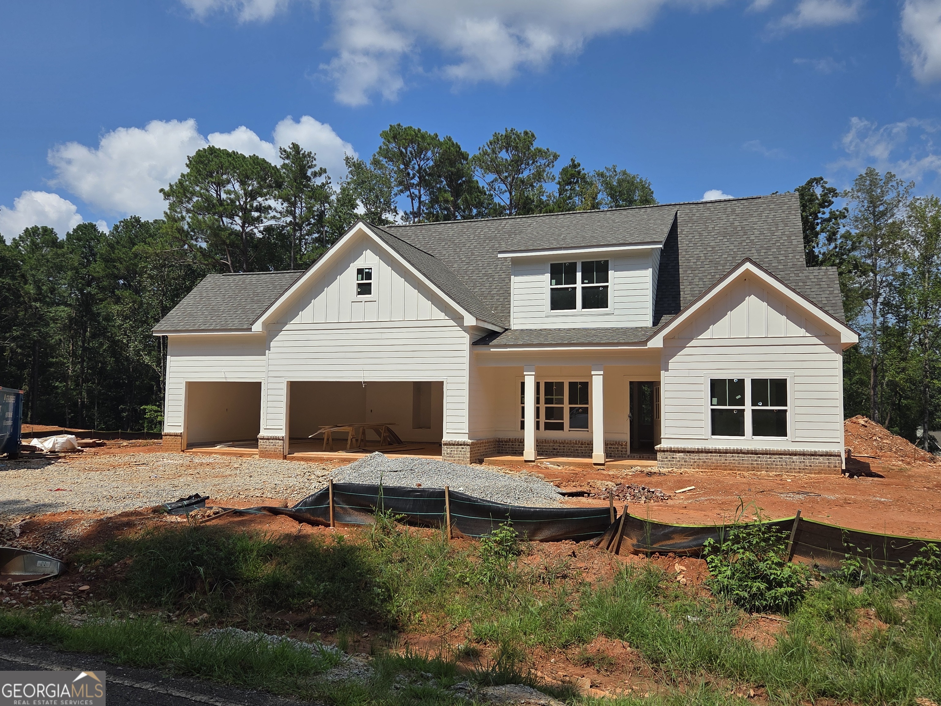 Location, Location, Location!! New Construction from Green Park Homes. This 4 bedroom 3 bath Cottage with bonus room is located in the heart of Lake Oconee. Located in Martin Oaks community which is very close to Harmony Crossing and the future Publix. The home boasts a great 3 car garage and outdoor covered porch with a fireplace! The open floor plan features a chefs kitchen with SS appliances, Island, owners suite and guest bedroom. Vaulted ceilings in the family room, Luxury vinyl plank floors and linear electric FP, this all on the main level. Upstairs you will be able to enjoy a large flex room/media room along with 2 additional bedrooms and a full bath.