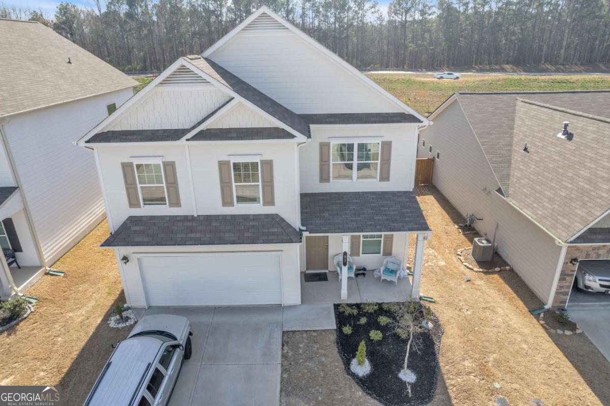 Welcome to your new home, enjoy this peace of Jasper at 97 Crossroad Circle! This charming residence offers 3 bedrooms and 2.5 bathrooms, providing ample space and modern comfort. The main level features a spacious owner's suite for added convenience, while the open-concept kitchen boasts granite countertops, a stylish tile backsplash, and upgraded cabinetry, seamlessly flowing into the cozy living room perfect for gatherings. Upstairs, additional bedrooms ensure privacy and flexibility for your family's needs. Enjoy outdoor living with a covered patio, ideal for relaxation or entertaining. Don't miss this opportunity to make this beautiful house your home!
