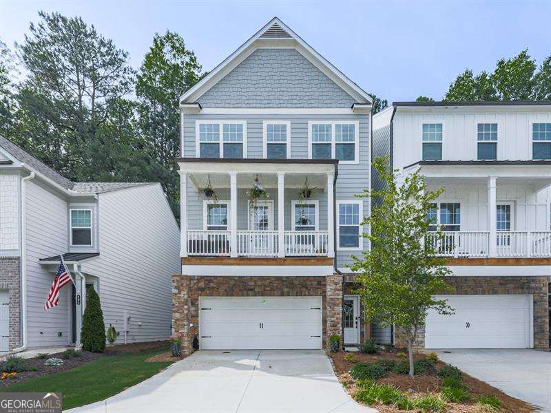 Downtown Woodstock GEM! Walkable, Stylish and Practically NEW! Welcome to this stunning 3-bedroom, 2.5-bathroom home located right in Downtown Woodstock. Built in 2023 and beautifully maintained, this home offers the perfect blend of modern design and unbeatable location. Open concept layout, light-filled living spaces designed for everyday comfort and entertaining. Flex room off the kitchen, perfect for a home office, playroom or cozy den. Interior features you will absolutely love is a custom pantry for stylish and organized storage. Custom primary closet with thoughtful design and space. Gorgeous finishes and custom light fixtures. Spacious bedrooms and modern bathrooms. Covered front deck you can drink your coffee or ready a book! 10x20 COVERED back patio, ideal for relaxing, dining, and entertaining. Flat usable backyard that backs up to woods! Unfinished basement, stubbed for a future bathroom and ready to make your own. This charming home as a unique backyard surprise; a picturesque train track that runs along the backside of property. The train passes only on weekdays, mid-morning and early afternoon, offering a fun, occasional spectacle during the day! Walkable lifestyle, just steps from vibrant restaurants, shops, and entertainment. Golf cart friendly, just cruise around the neighborhood and downtown Woodstock with ease. Walk or just ride your golf cart to Downtown Woodstock's best spots. Quick access to parks, trails, top schools, and major roads. A rare opportunity to live in a nearly new home so close to all the action.