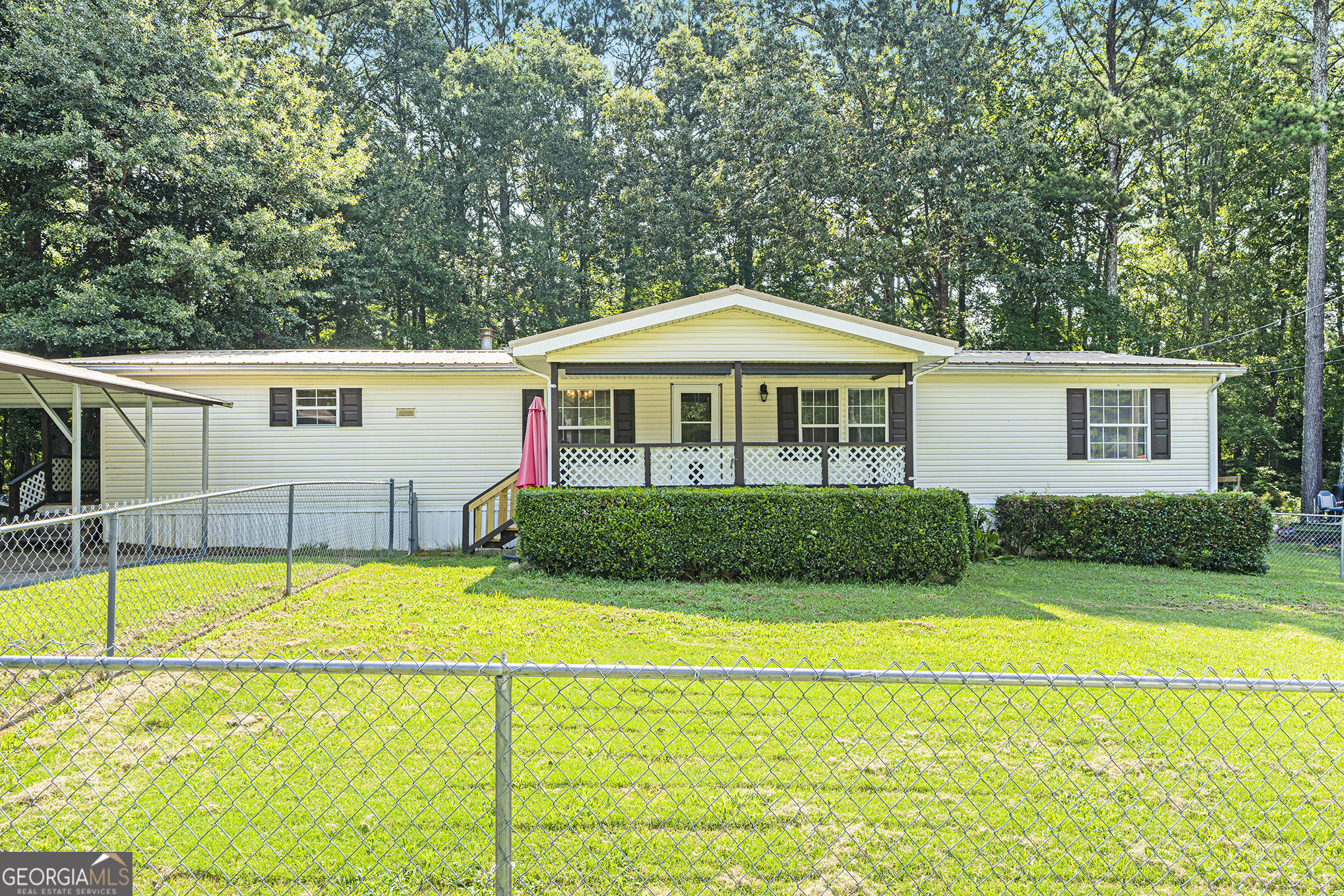 Welcome to this very well-maintained, move-in ready home featuring 3 spacious bedrooms and 2 beautifully updated bathrooms. Each bedroom offers the convenience of walk-in closets, providing plenty of storage for everyone. Enjoy peace of mind with a durable metal roof and a newer HVAC system that's still under warranty. You'll love the added bonus of a large storage room and an oversized storage shed-perfect for tools, hobbies, or seasonal items. Relax and unwind on the charming wraparound porch or the covered front porch, ideal for enjoying morning coffee or evening sunsets. A large carport provides ample covered parking. This home has been thoughtfully cared for and is ready for its next owner-come see it today!