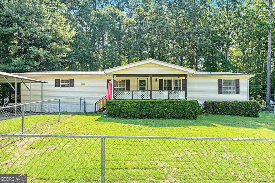 Welcome to this very well-maintained, move-in ready home featuring 3 spacious bedrooms and 2 beautifully updated bathrooms. Each bedroom offers the convenience of walk-in closets, providing plenty of storage for everyone.  Enjoy peace of mind with a durable metal roof and a newer HVAC system that's still under warranty. You'll love the added bonus of a large storage room and an oversized storage shed-perfect for tools, hobbies, or seasonal items.  Relax and unwind on the charming wraparound porch or the covered front porch, ideal for enjoying morning coffee or evening sunsets. A large carport provides ample covered parking.  This home has been thoughtfully cared for and is ready for its next owner-come see it today!