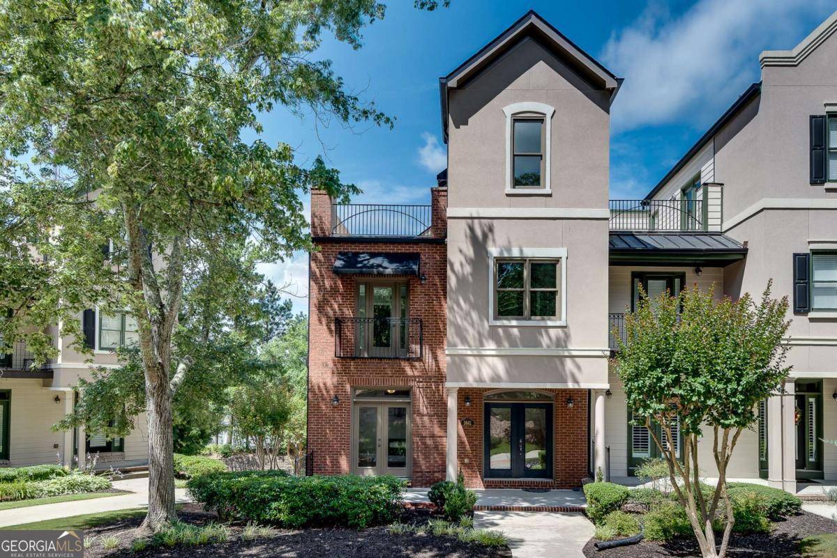 Chic End-Unit Townhome with Rooftop Oasis - Walk to Downtown Duluth! Live in the heart of it all at this beautifully updated 3-bedroom, 2.5-bath end-unit townhome just steps from Downtown Duluth's shopping, dining, parks, and festivals! Freshly painted with refinished hardwoods and brand-new carpeting, this light-filled home shines from top to bottom. Enjoy four spacious levels, including a sleek rooftop patio-perfect for morning coffee or entertaining under the stars. The open main level features a modern kitchen, generous living space, and tons of natural light. Located in the highly rated Coleman STEAM School District, this is urban-suburban living at its best. Move-In Ready, Entire interior painted, main level hardwoods refinished, back deck re-stained and new carpeting in bedrooms. Roof approximately 5 years old. Don't miss it! Schedule your tour today!