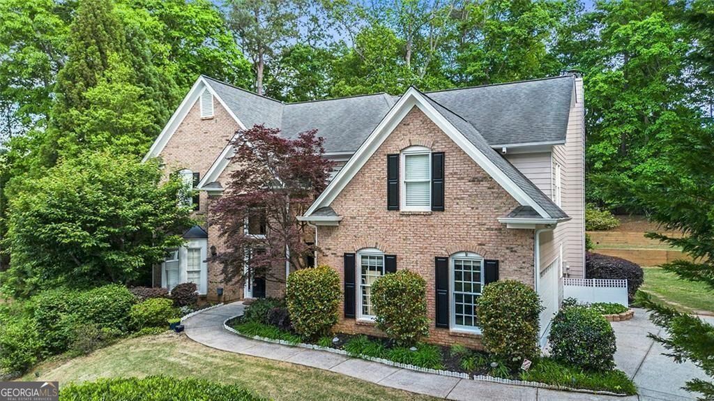 Beautiful Home in Forsyth County with Alpharetta Address - Great Schools & Tons of Upgrades! Major systems are already taken care of with 2 NEW HVAC units, FRESH EXTERIOR PAINT, NEW GARAGE DOOR and NEW garbage disposal all done just last year. STAINLESS STEEL appliances replaced in 2022. The MAIN LEVEL boasts BRAND NEW FLOORING, flowing seamlessly through a formal living and dining room enhanced by a tray ceiling-perfect for entertaining. The heart of the home is the spacious two-story great room, complete with rear stairs, creating a grand yet cozy atmosphere. The chef's kitchen features newly refinished maple cabinets, granite countertops, a large center island, walk-in pantry, and plenty of workspace-ideal for everyday living and entertaining alike. Upstairs, retreat to a spacious master suite with a serene sitting area. The vaulted master bath offers a spa-like experience with double vanities, a separate shower, and a jacuzzi tub. Custom closets throughout the home ensure organization meets elegance, and custom decorative window treatments add a designer touch in every room. Enjoy outdoor living on the brick patio, shaded by a pergola - a private oasis right in your backyard. This home perfectly blends comfort, style, and location. Don't miss your chance to own this gem!