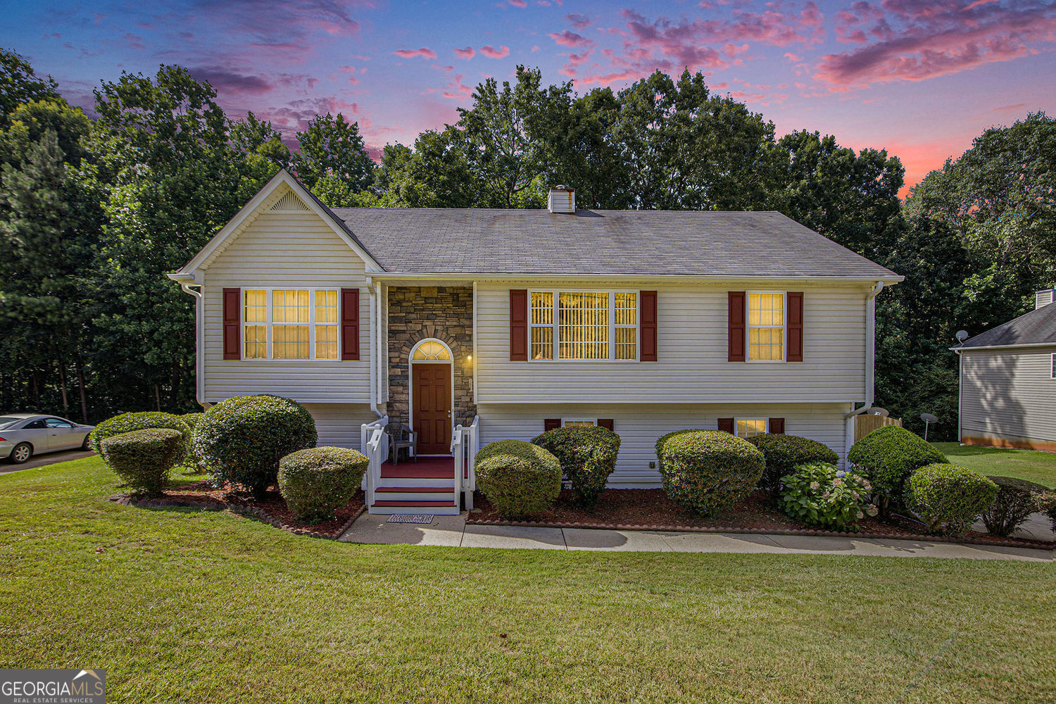 Step into comfort and character in this beautifully maintained split-foyer home located in a quiet Douglasville neighborhood. With 3 spacious bedrooms and 3 full bathrooms, this home offers the perfect blend of functionality and style for everyday living and entertaining. The heart of the home features an open-concept layout with vaulted ceilings and a stunning double-sided fireplace that connects the living and dining areas, creating a cozy and elegant atmosphere. Natural light pours in through oversized windows, highlighting the updated flooring and thoughtful design details. The kitchen is equipped with sleek stainless steel appliances and ample counter space, ideal for preparing your favorite meals and hosting gatherings. Downstairs, the fully finished basement provides a flexible space perfect for a media room, home office, guest suite, or recreational area with a full bathroom. Step outside to enjoy the fenced-in backyard-ideal for pets, play, or peaceful evenings under the stars. The large side-entry garage offers extra storage and easy access. This layout suits many lifestyles.