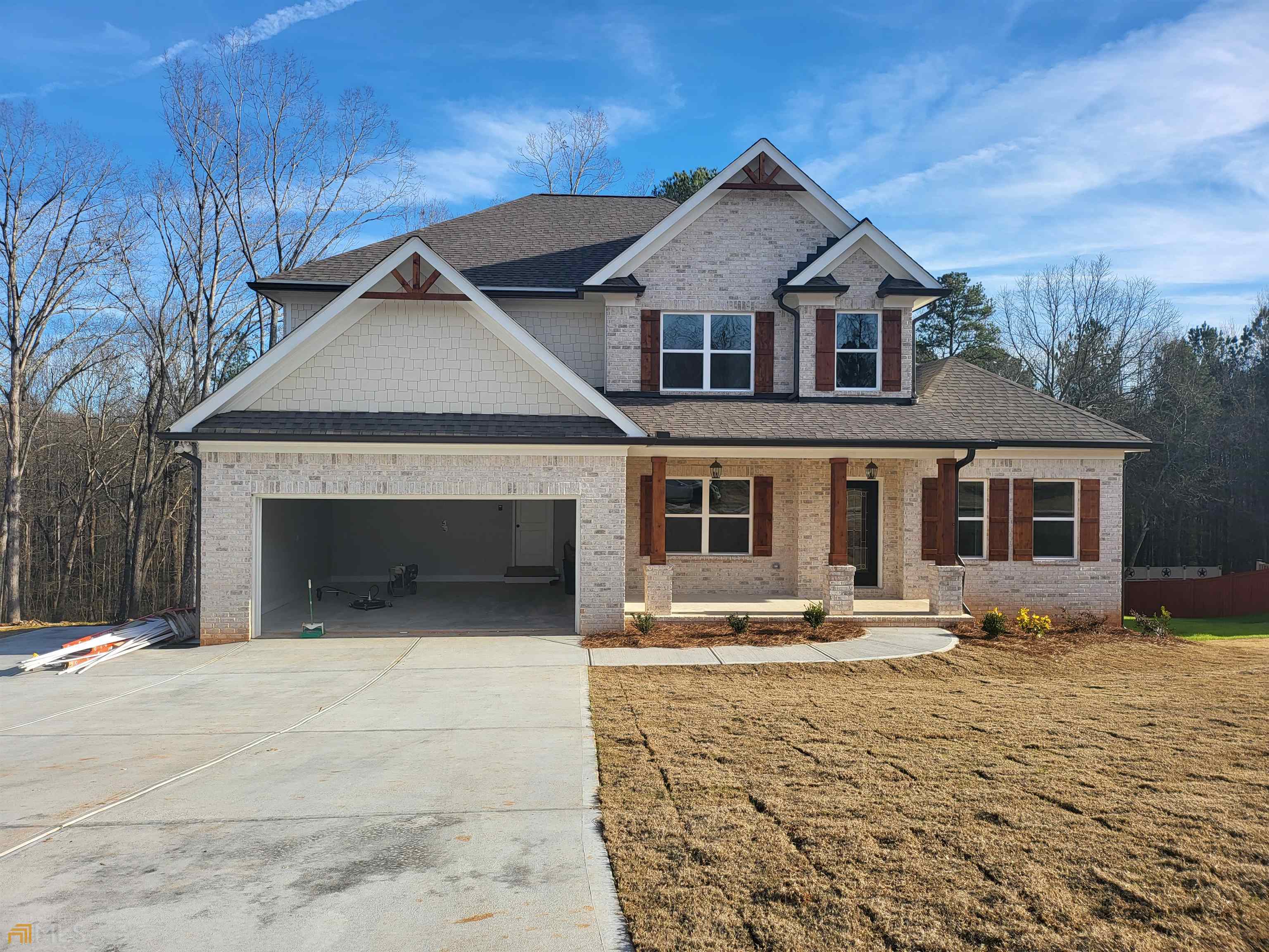 Craftsman style 3 sided brick two story on unfinished basement, 4 bedroom, 3 1/2 bath, solid surface granite countertops throughout, custom white cabinets, kitchen has walk in pantry, island, backsplash, oven, microwave & dishwasher, open floor plan with custom trim package, hardwood floors on mail level, tile accent wood burning fireplace in greatroom, separate dining room, master on main, master bath has tile flooring and tile separate shower, garden tub, bonus room, media room, warranty, Redbud Plan, features may vary, photos are of the home plan being constructed not of the actual subject property. Approximate 4 month build time from listing date.