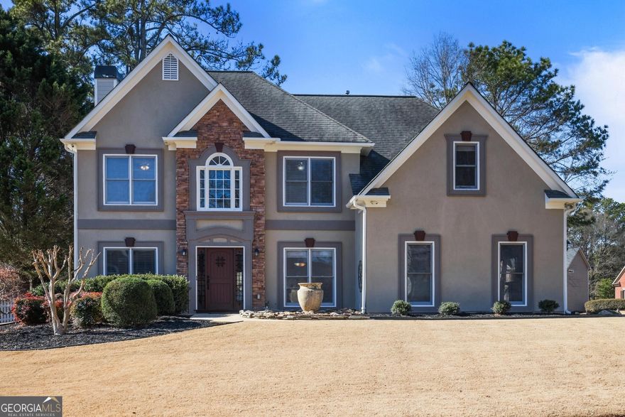 Come see this beautiful 4 bedroom/ 3 bath home located in the quiet, highly sought after Cameron Park  subdivision.  This home sits on a .3024 acre level, corner lot, and is well landscaped and has a long driveway. Plenty of parking for family and guests. Walking into the 2 story foyer home, you will see an office/ flex room to the left and spacious dining room to the right.  Further into the home is a 2 story great room with a stone fireplace and new flooring. The kitchen opens to the great room, has granite countertops, and stainless appliances.  There is a pantry in the eat in kitchen area that leads to the fabulous sun room with windows galore! On the first floor there is also a bedroom, full bath and laundry room. Upstairs are two, spacious, secondary bedrooms and a very spacious owner's suite with a sitting room and tray ceilings.  There is also a second laundry upstairs. Additional improvements to the home include new water heater 2024; new paint - interior and exterior (2024/2025), new AC unit, updating of many of the fans and lighting throughout the house, painted the garage floor (2025), and new fence. Amenities are located in the neighboring community Cameron Glen and include swimming pool, tennis court, picnic area, and clubhouse. Convenient to I 75, Hwy 41, Marietta Square, Walker School, Kennesaw Mountain National Park and Kennestone Hospital.