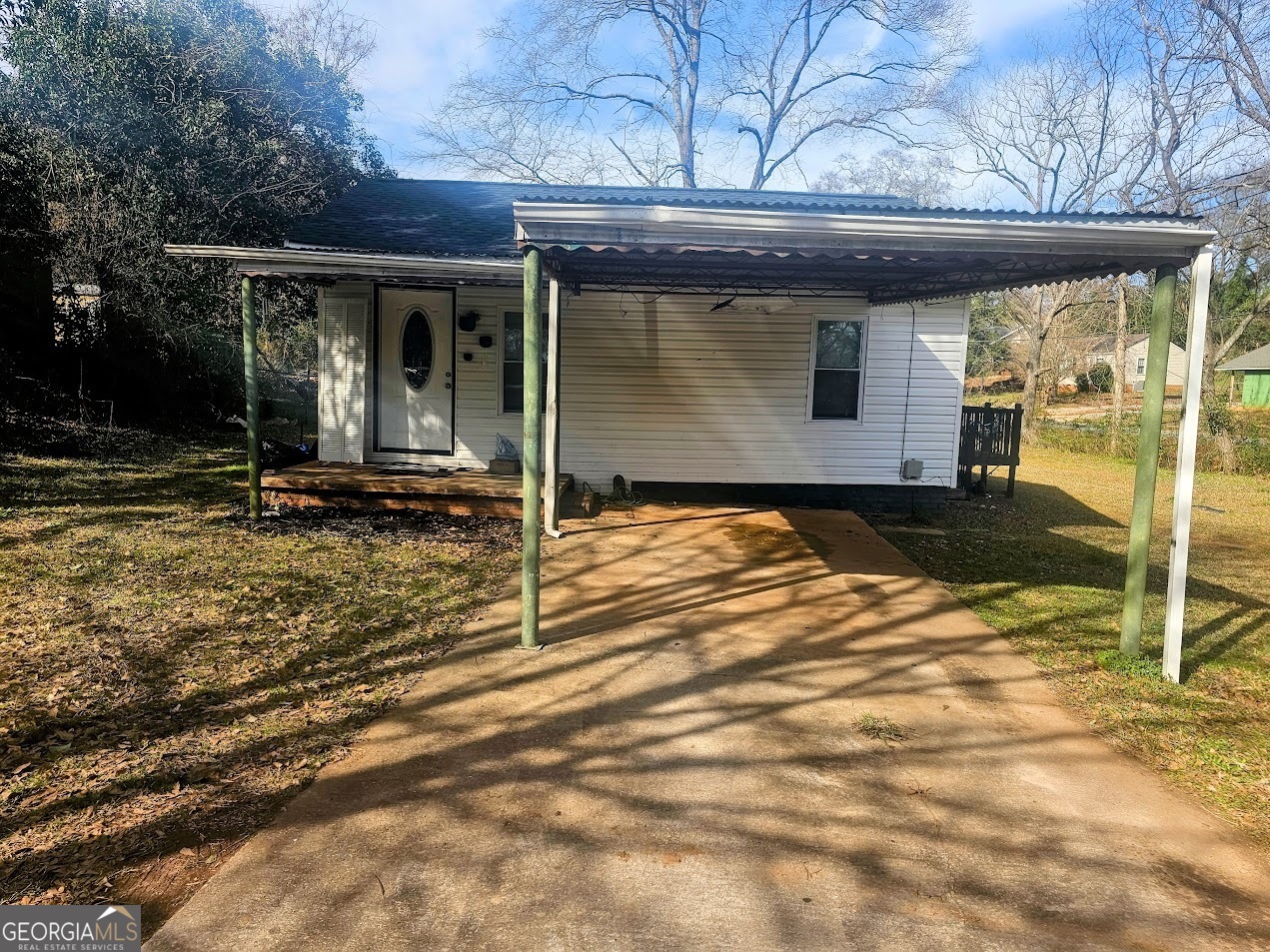 Remodeled 2 bedroom 1 bath home within walking distance to town, middle school, football field, City Park- home has split bedroom plan- country kitchen, open floor plan- 2 decks one off the mud room and one in the rear of the property- one car carport attached- large corner lot partially fenced in back yard- great for retired couple, first time home buyer- total electric- newly remodeled- roof is less than a year old- - this one will not last long-