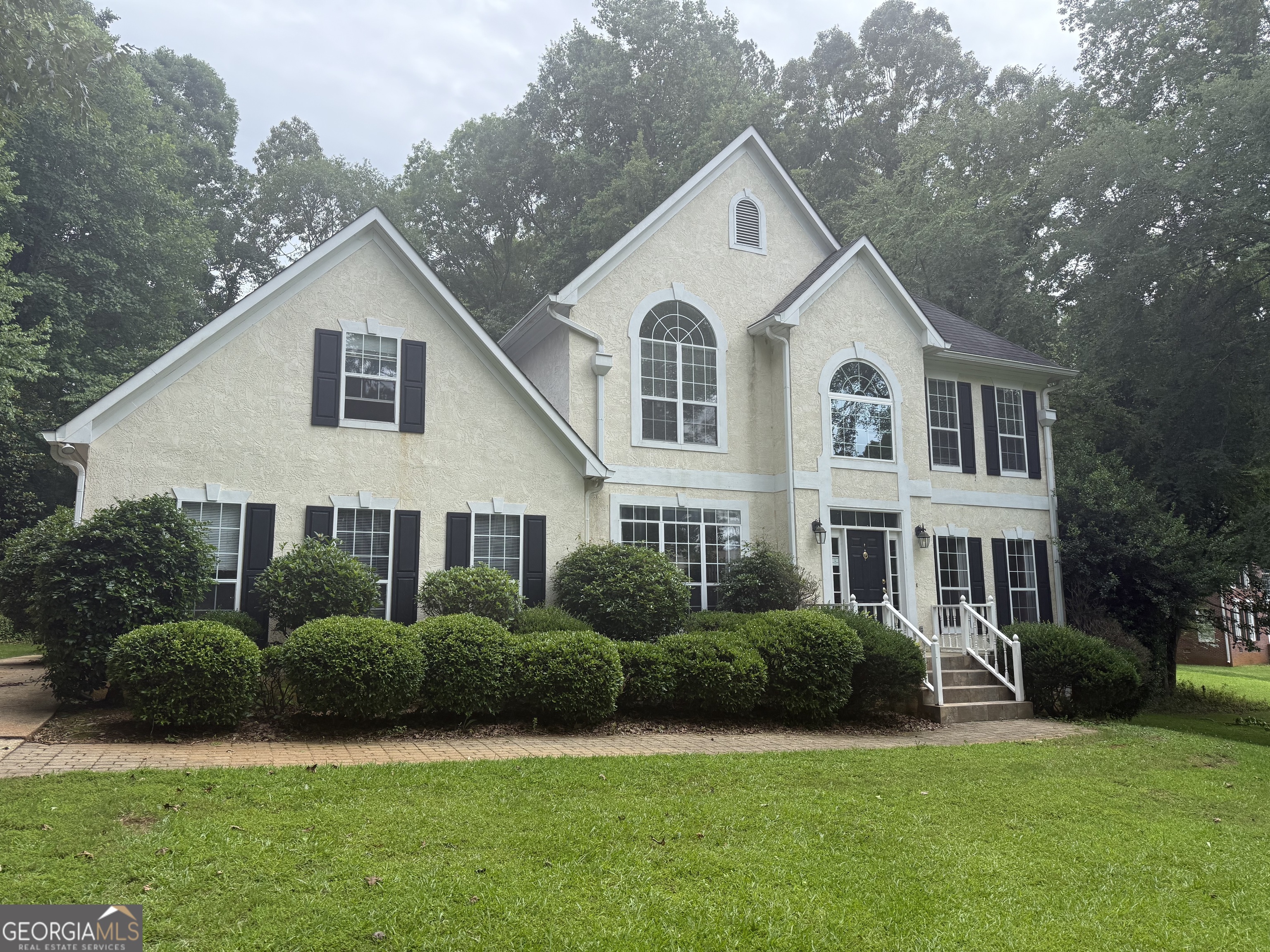 This spacious traditional 5 bedroom, 3.5 bath home in sought after Cameron Pointe subdivision offers over 3000 sq ft. It is the perfect home for families or anyone who loves to entertain. The main level features a large primary suite with a spa-like bathroom, including a garden tub, separate custom shower, and dual vanities. Not to mention the huge walk in closet. The kitchen boasts granite countertops, stainless steel appliances, and eat at bar and seperate breakfast area. The half bath and very spacious laundry room is off the kitchen area. This also opens to a cozy family room with a fireplace. Hardwood floors flow throughout the main living areas, while a bright sunroom provides the perfect spot to relax and enjoy views of the private backyard and deck. There is an additional living room and dining room. Upstairs there are 4 large bedrooms and 2 more full baths. Situated on a generous 1-acre corner lot, this home is just steps away from the community pool and tennis courts, and is zoned for the award-winning Hillcrest Elementary School. With a peaceful neighborhood setting and convenient access to West Point Lake, shopping, and dining, this home is a rare find that blends comfort, style, and Southern charm. Nestled in the highlydesirable Cameron Pointe subdivision in LaGrange's coveted Hillcrest Elementary zone, 102 Cameron Pointe Drive is a striking traditional twostory residence offering comfort, style, and convenience.