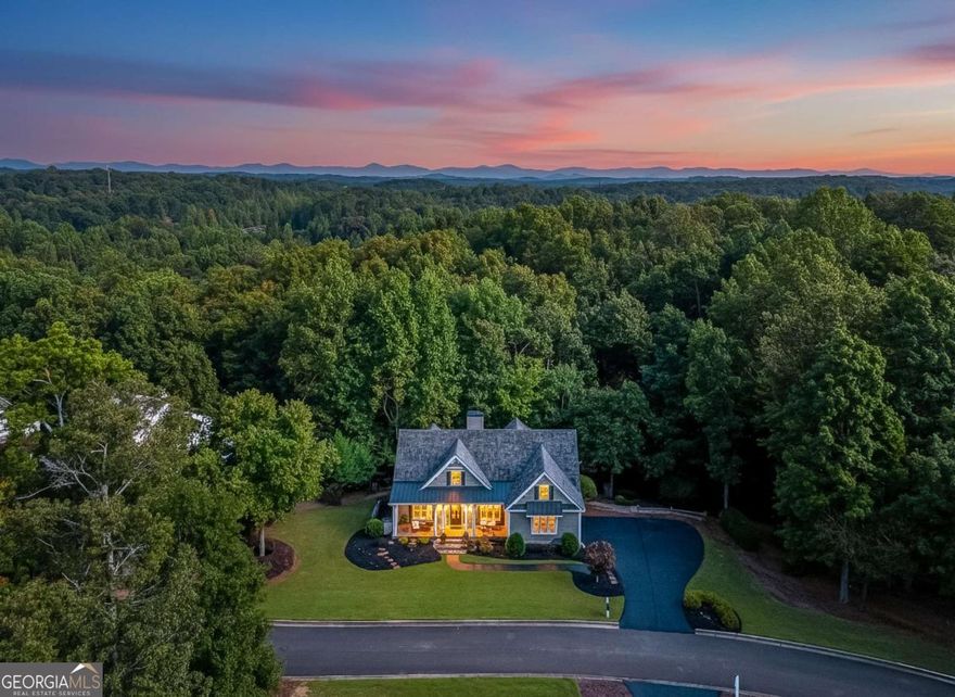 Located in the Sought-After Chestatee Lake & Golf Community    Welcome to 189 Scarlet Oak Lane - a beautifully maintained, designer-finished home situated on one of the largest and most private corner lots in the highly desirable Northeast Cove section of the Chestatee Lake and Golf Community. This stunning Craftsman Cottage is a ranch-style home with a finished terrace level offering the ideal blend of comfort, style, and functionality - perfect for everyday living or entertaining guests.    Key Features:    Like-new cedar shake roof, only 6 years old with a 30-year lifespan- Two HVAC systems: One brand new, the other well-maintained and only 10 years old- Open-concept floor plan with soaring high ceilings throughout- Fully remodeled chef's kitchen featuring a large center island, gas range with custom hood, high-end stainless appliances, and elegant quartzite countertops and large island- Designer finishes throughout the home- Spacious screened-in porch overlooking a private backyard oasis- Expansive outdoor living space complete with a firepit area - perfect for relaxing or entertaining- Desirable ranch layout with additional living and guest space on the finished terrace level- Community Amenities:    Great social atmosphere in resort style neighborhood w/ clubs, events, and social committees- Enjoy the resort-like lifestyle offered by the Chestatee Lake and Golf Community, which includes:    Award-winning 18-hole golf course- Private marina with boat slips on Lake Lanier- Clubhouse with restaurant/dining and social events- Swimming pool & tennis/pickle ball courts- Bocce Ball Courts- Walking trails, parks, and playground- Regularly planned community events and clubs for all ages- Location & Convenience:    Nestled in the scenic beauty of Dawsonville, this home offers quick access to all modern conveniences:    Just minutes from North Georgia Premium Outlets, Publix, Kroger, and a wide variety of shopping and dining options    Easy access to GA-400, making commuting a breeze    Close proximity to Northside Hospital Forsyth, Northeast Georgia Medical Center, and other healthcare providers.  Enjoy nearby attractions including Lake Lanier, Amicalola Falls, and the Dahlonega Wine Country    Top-Rated Schools:    Families will appreciate being zoned for some of the area's top-rated schools in the Dawson County School District, known for strong academics, athletics, and a supportive community environment.    Don't Miss This Opportunity!    Whether you're looking for your forever home, a serene lake/golf retreat, or the perfect place to entertain family and friends, 189 Scarlet Oak Lane checks all the boxes. This is a rare opportunity to own a thoughtfully designed, move-in-ready home in one of North Georgia's most beloved lake and golf communities.    Schedule your private showing and golf cart tour today and experience the Chestatee resort lifestyle!
