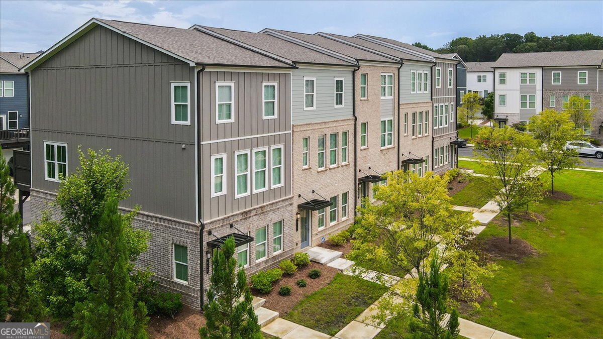 Nearly-New Townhome with Warranty Coverage, Prime Location & Modern Comfort - Waverly at Buice Lake Step into this nearly-new 3-story townhome, still under its 2nd year of 2-10 builder warranty as well as the structural warranty-offering peace of mind for years to come. Located in the highly desirable Waverly at Buice Lake community in Acworth, GA, this 3-bedroom, 2 full and 2 half bath home blends modern design with flexible functionality and a location that's hard to beat. The first floor features a versatile flex space-perfect for a home office, guest suite, workout area, or playroom. On the second floor, enjoy an open-concept layout with a spacious living room, dining area, and kitchen that flows out to a private deck, ideal for relaxing or entertaining. Upstairs, the third level hosts a generous primary suite with a walk-in closet and en-suite bath, along with two additional guest bedrooms and a second full bath. A convenient laundry area is also located on this level. All appliances-including washer and dryer-are included, making this home truly move-in ready. As part of Waverly at Buice Lake, you'll enjoy incredible amenities: pool, pickleball courts, playgrounds, clubhouse, scenic trails, and a tranquil lake. The HOA covers master insurance, exterior maintenance (including the roof), landscaping, trash and recycling services, and upkeep of all shared areas-giving you more time to enjoy your home without the hassle. And when it comes to location-you're just steps away from the charm of Downtown Woodstock, and only minutes from Kennesaw, Marietta, and I-75, making commuting and weekend plans effortless. This is your chance to own a like-new, low-maintenance home in one of Acworth's most vibrant and growing communities. Schedule your tour today!