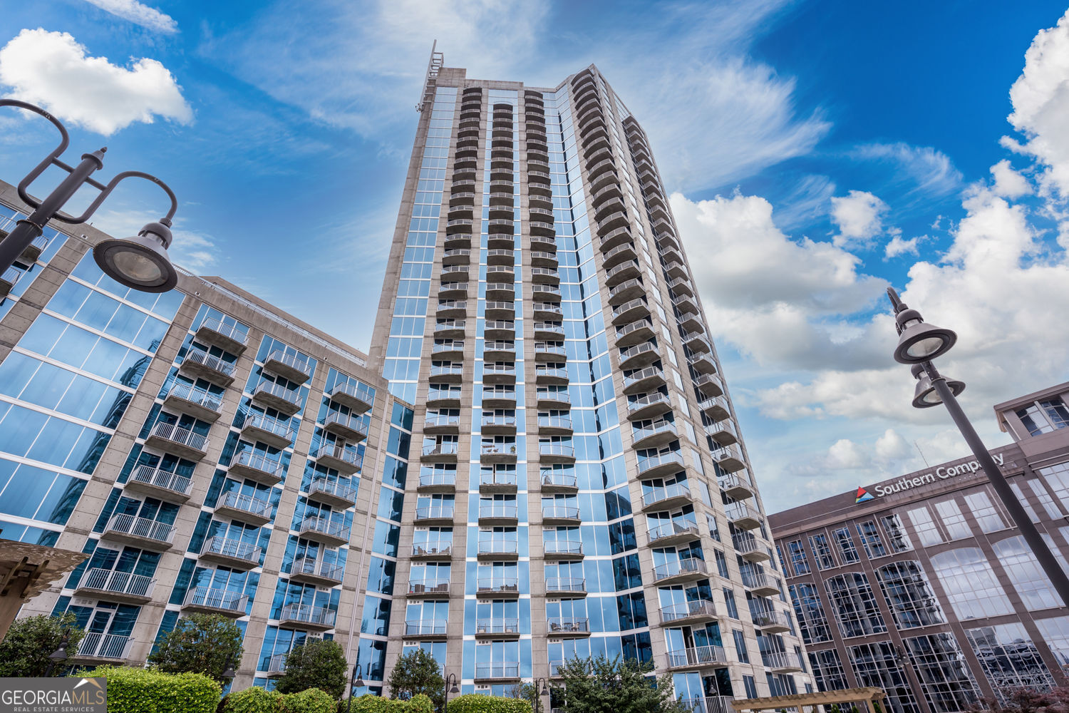 Luxury Living with Iconic Views | 2BR/2BA Corner Unit on the 37th Floor - Twelve Centennial Park, Atlanta Welcome to upscale high-rise living in the heart of Downtown Atlanta. This stunning 2-bedroom, 2-bathroom corner unit sits on the 37th floor of the prestigious Twelve Centennial Park, offering unmatched panoramic skyline views through dramatic floor-to-ceiling windows-some of the most breathtaking views in the city. Location is unbeatable. Just steps from Emory Midtown and minutes from Midtown, Ponce City Market, Piedmont Park, Centennial Olympic Park, Georgia Tech, State Farm Arena, Mercedes-Benz Stadium, the Georgia Aquarium, World of Coca-Cola, and a vibrant mix of top-rated restaurants, bars, shops, and cultural attractions. Commuting is effortless with MARTA access just outside the building and easy highway connectivity. Inside, the thoughtfully designed roommate-style floorplan offers excellent privacy, with two spacious bedrooms, each featuring custom closets and en-suite bathrooms. The unit is filled with natural light and elevated by 10-foot ceilings, fresh paint, upgraded lighting, and modern systems including a newer HVAC and water heater. The sleek kitchen features granite countertops, stainless steel appliances, and an open-concept layout perfect for entertaining or relaxing in style. Optional: This unit can be rented fully furnished, offering a seamless move-in experience. Included Features: * Two reserved covered parking spaces near the elevator * 24-hour concierge, secured access, and smart entry system-access the building, elevator, and amenities with just a wave of your hand * Resort-style amenities: Heated rooftop pool, modern fitness center, business center, coffee bar lounge, theater room, recreation room, fenced dog park, and even room service via the connected hotel Don't miss this rare opportunity to lease a luxurious, move-in-ready residence in one of Atlanta's most exciting and evolving neighborhoods. Live above it all-literally and figuratively-in the heart of the city.