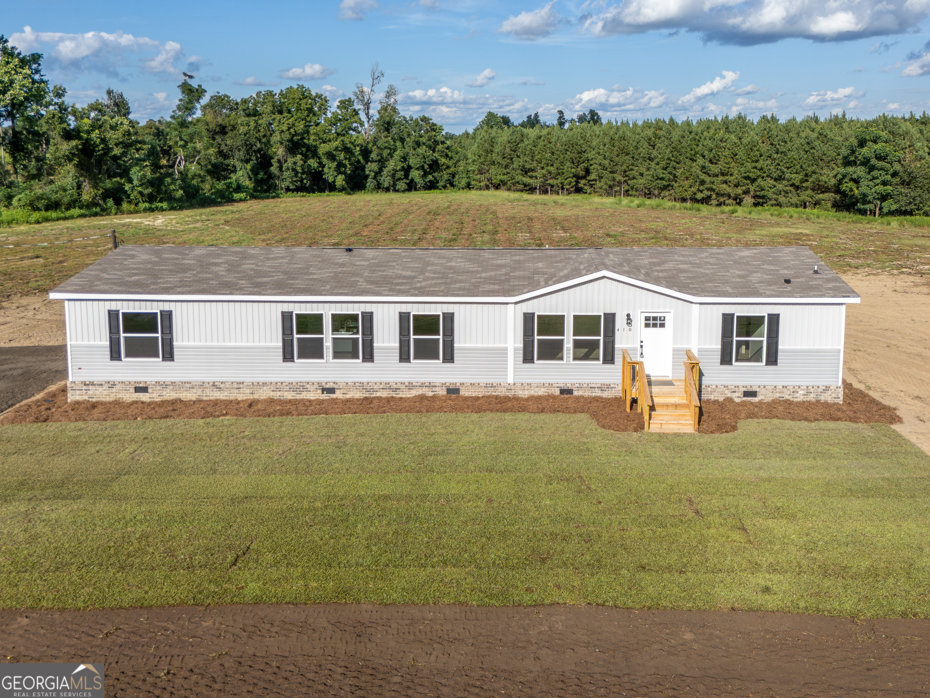 New 5 bedroom 3 bath home on 5.29 acres. The property is located near Garfield in Emanuel County. Beautiful home with great finishes and a floorplan perfect for a large or growing family. The property has it's own well and septic, both also brand new. The home is permanently affixed with bricked foundation and should qualify for all types of long term financing. Call the listing agent for more info.