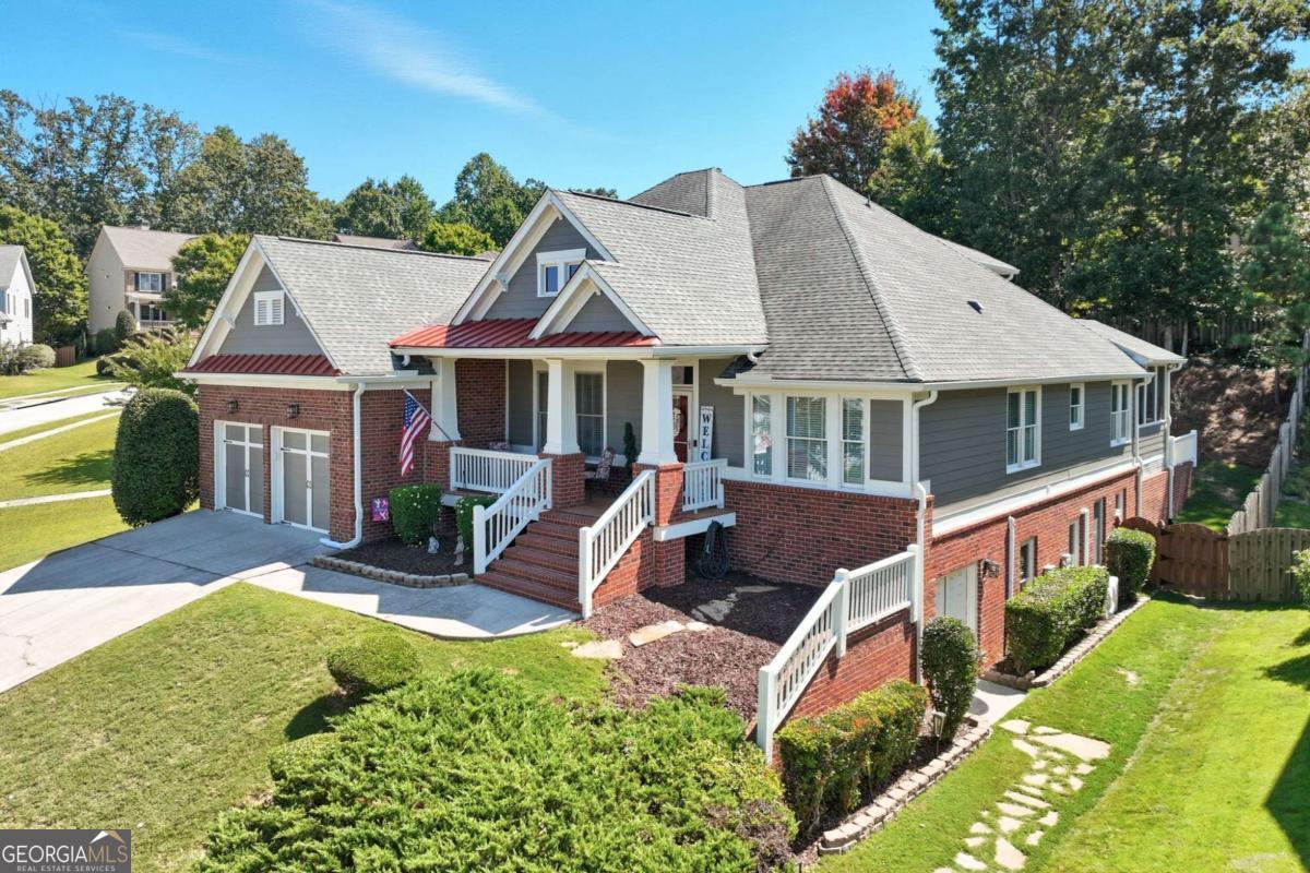 Welcome to Your Dream Home in Sterling on the Lake! This stunning Craftsman-style brick veneer home perfectly blends charm, functionality, and lifestyle. With 5 bedrooms, 3.5 baths, and 2,909 sq. ft. of thoughtfully designed living space, this home is ideal for families and those who love to entertain. Tucked on a quiet, family-friendly street, the property boasts a steep driveway that leads to an oversized garage with a surprising amount of extra space - perfect for larger vehicles, trash can storage, and more. Inside, you'll find an open floor plan filled with natural light, creating a warm and inviting atmosphere. The chef's kitchen features a Gas Flex Duo Range with dual doors (also prepped for electric if preferred), granite countertops, and plenty of prep space for hosting family get-togethers or parties with friends. Upstairs, a private guest or teen suite offers comfort and privacy, while the spacious primary suite includes a cozy sitting/reading area for your own retreat. The basement offers even more versatility, with space for a shop or hobby area plus a side entrance to a fully equipped dog grooming business - freshly cleaned by Stanley Steamer and available for sale separately as a profitable turnkey opportunity. Relax in the peaceful backyard on your screened-in porch. You are surrounded by great neighbors that are there to lend a hand. Here, you're not just buying a home - you're buying a lifestyle. Enjoy neighborhood concerts, fireworks, community events, pools with lifeguards, and endless outdoor activities like kayaking, walking trails, tennis, and pickleball. Come see why life is better at Sterling on the Lake - this home is ready to welcome you!