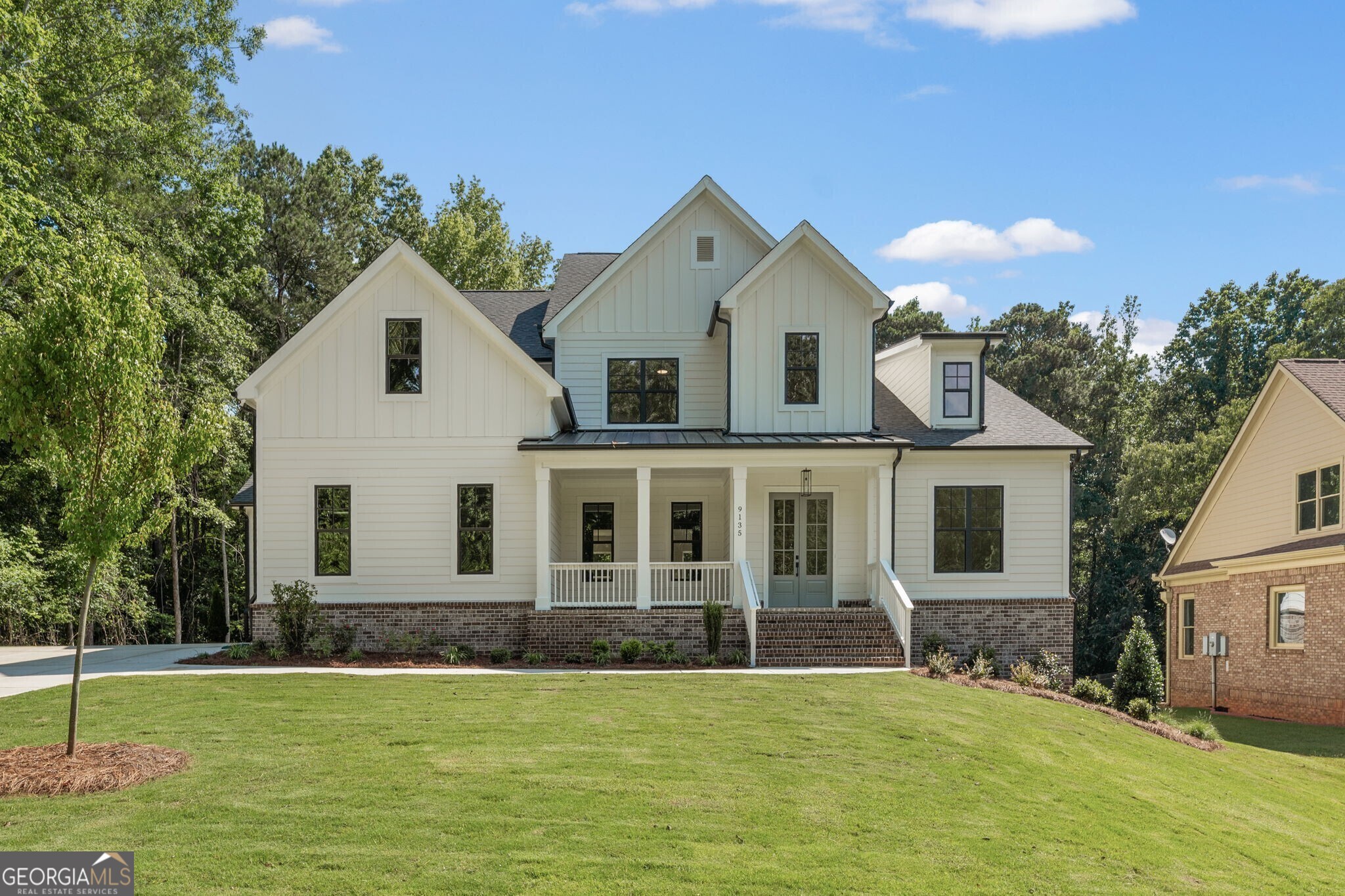 The Milton II Plan built by Peachtree Residential Properties. Quick Move-In! This brand new home has it all and offers a perfect blend of a beautiful new home and a place to enjoy the lake. All the homes in this 15 homesite community come with a deeded, covered, deepwater slip located at the community dock. The lake is just a quick golf cart ride away for you to enjoy your boating adventures. The foyer is flanked by the Dining Room and a Study/Office tucked away in the front making it a quiet place to work. The large 2 story Family Room has a fireplace with built-in cabinets on both sides and a wood fireplace surround. The open concept living is perfect for entertaining with a door leading to the deck. The sunny kitchen sink has plenty of cabinets to the ceiling, large Island, SS Kitchen Aid appliances, pantry and eating area. The Laundry Room and Powder Room are conveniently located off the Mudroom. The Owner's Suite, with a trey ceiling, is located on the main floor. The Owner's Bath has a shower, soaking tub and double vanities with quartz countertop as well as a walk-in closet. There is a catwalk upstairs overlooking the Family Room with a stained railing and metal balusters leading to a Bonus Room and 3 secondary bedrooms. Two of the bedrooms share a bathroom with separate vanities and walk-in closets. There is also a bedroom with a private bath. There are engineered hardwoods in the main living areas, carpet in the bedrooms and tile in the Laundry Room and Baths. Large Unfinished storage room upstairs. The large unfinished basement is perfect for a growing family. This home has a 2-car side entry garage and a tandem garage. There is also a huge unfinished storage room upstairs. Hardwood on the main floor and upstairs hallway. This community is a perfect place to call home and is minutes away lake fun, dining and shopping!