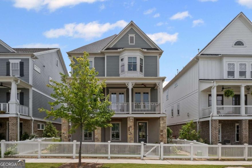 Experience Elevated Living at South on Main - Downtown Woodstock's Most Coveted Luxury Community. Welcome to your dream home in the heart of vibrant Downtown Woodstock! Nestled in the premier South on Main neighborhood, this impeccably designed, nearly new 3-story masterpiece is just steps from top-tier restaurants, boutique shopping, and year-round events.  Built only 2 years ago and packed with luxury upgrades, this home seamlessly combines modern sophistication with timeless elegance. Boasting 4 spacious bedrooms, 4.5 designer baths, and your very own private elevator, this residence is built for effortless entertaining and everyday ease.  The main level offers a fluid open-concept layout adorned with rich hardwoods, custom molding, and designer finishes throughout. Enjoy a dedicated home office, a refined formal dining room, and a warm, inviting family room with a fireplace featuring a custom mantel and bespoke trim work. The chef's kitchen is a true showpiece, equipped with Silestone Cosentino quartz countertops, a high-end Thermador range, custom vent hood, waterfall-edge island, quartz backsplash, a stainless apron-front sink, built-in microwave, and soft-close cabinetry-a dream for culinary enthusiasts.  Upstairs, retreat to your luxurious primary suite featuring a spa-like ensuite with soaking tub, quartz counters, oversized walk-in shower, and designer tile selections. The terrace level includes a generously sized flex room with a full bath-ideal for guests, a gym, or a private workspace. Step outside and enjoy two fabulous outdoor spaces: a covered front porch with Trex decking overlooking community gardens and firepits, and a freshly stained wraparound back deck perfect for evening gatherings under the stars.  Additional features include:  Custom blinds and roller shades, Designer lighting throughout, 3-car garage with professional epoxy floors, Whole-house water filtration system and Professionally landscaped grounds.  South on Main offers unmatched community amenities: a resort-style pool, clubhouse, fitness center, two dog parks, an amphitheater, and a full calendar of concerts, festivals, and neighborhood events. Direct access to the Noonday Trail adds even more to love.  Skip the wait and expense of new construction-this turnkey, gently lived-in home is move-in ready and brimming with upgrades you won't find elsewhere.  Schedule your private tour today and experience the best of Downtown Woodstock living!