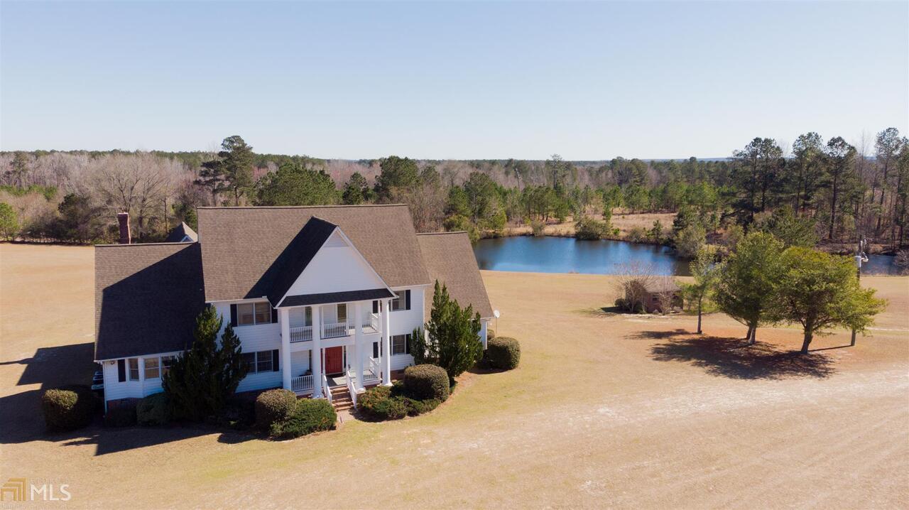 IF PRIVACY IS YOUR DESIRE THIS BEAUTIFUL CUSTOM HOME WITH OVER 6000 SQ FT OF LIVING SPACE, WITH 4 BEDROOMS, 5.5 BATHROOM IS WAITING FOR YOU! AN ADDED BONUS IS A MOTHER IN LAW SUITE WITH AN ADDITIONAL FULL KITCHEN. ENTERTAINERS PARADISE! LOCATED ON 32+/- ACRES WITH A STOCKED POND FOR FISHING, A BEAUTIFUL SWIMMING POOL, 9+/- ACRE CULTIVATED DOVE FIELD, 1200 SQ FT PUMP HOUSE PLUMBED FOR BATHROOM & 5+ ACRES MATURE TIMBER. THIS BEAUTIFUL PROPERTY IS A MUST HAVE! IF YOU HAVE A PRIVATE PLANE, JUST 5 MILES FROM MILLEN IS AN AIRPORT FOR YOUR CONVENIENCE! ENJOY SPENDING YOUR DAYS FISHING, HUNTING, WALKING/JOGGING THE PROPERTY OR ATV RIDING.