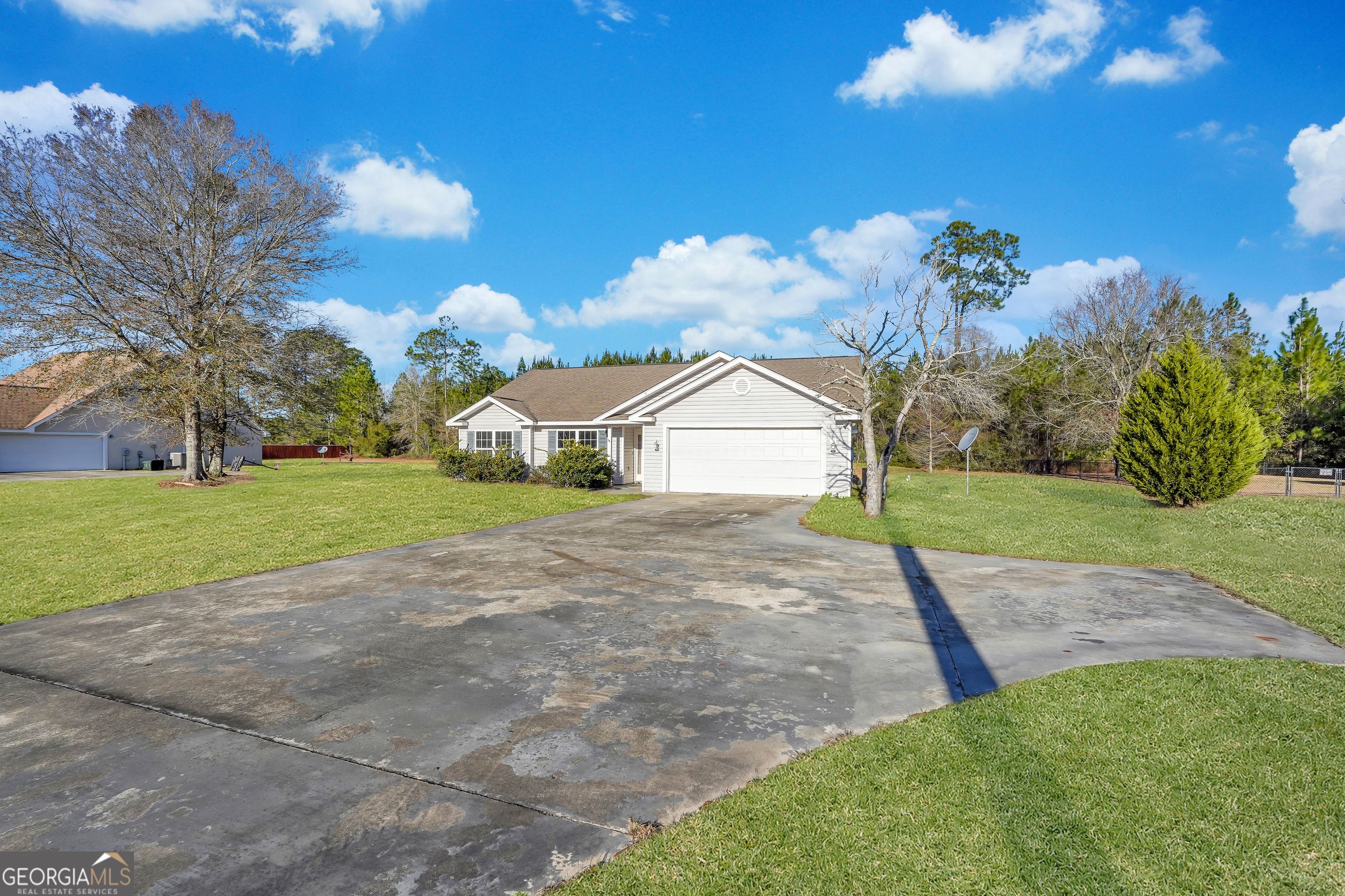 Luxury meets Southern charm! This impeccably designed home features a spacious open floor plan, a gourmet kitchen, and a master suite oasis. Enjoy outdoor living in the sprawling backyard with a covered patio. Conveniently located yet offering tranquility, this property is a rare gem. Newer stainless steel appliances, HOME WARRANTY COVERAGE, and GA Termite Clearance Letter & Bond, comparable to New Construction with NO HOA! Near schools, shopping, recreational activities, and Fort Stewart.