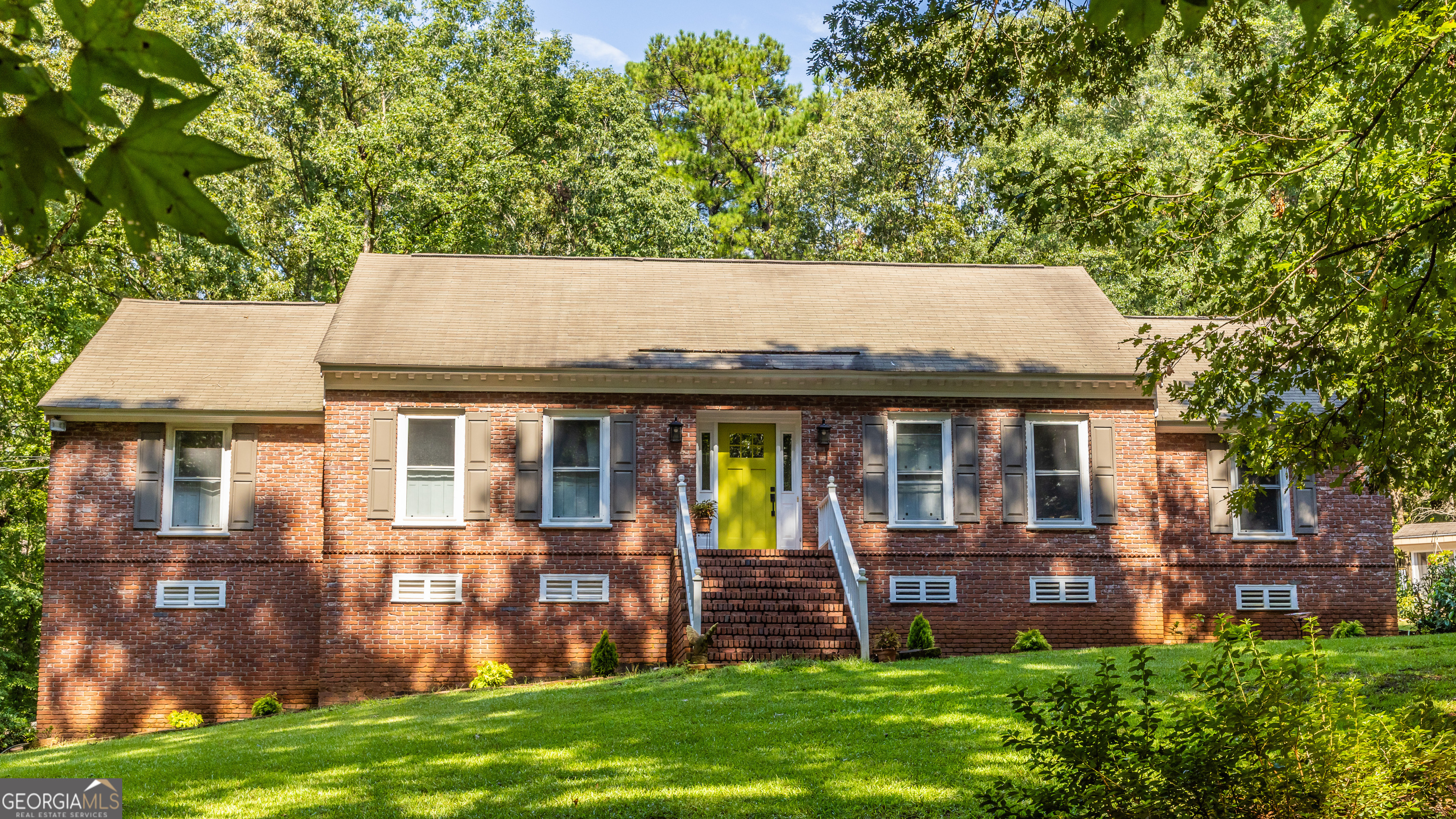 Gorgeous Brick Home located on 2.6 acres! Come home to privacy and enjoy winding down in your beautiful sunporch that overlooks a fenced backyard. Primary bedroom is on the main level and includes a sitting area and two walk-in closets. Primary bathroom was remodeled less than two years ago and has a fabulous walk in shower and separate tub. There is a second bedroom on the main level and a third bedroom and bathroom in sunlit walk out basement. Game Room or Family Room with built in bookshelves and sink in basement as well! Possibly rent basement for passive income! Current owner also remodeled the kitchen and yes, its fabulous too! Gas stove top and electric oven are the perfect combination! Prepare dinner with family/friends and stay connected with everyone in keeping area that has wood burning fireplace and built in bookcase. Lot has beautiful hardwoods, potting shed, detached summer porch, framed partially with beautiful brick wall. See it in September!