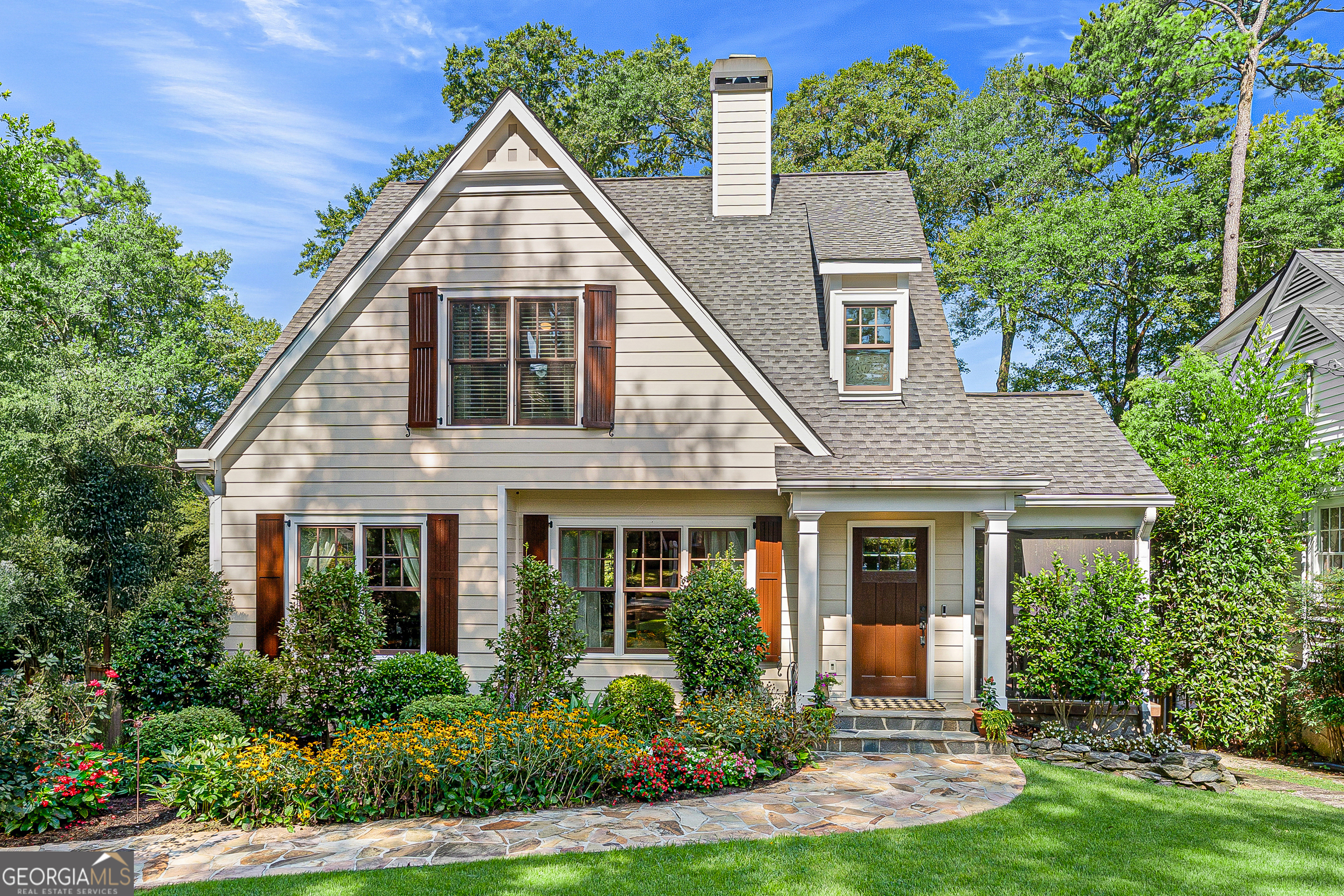 Welcome to this stunning, completely renovated 1939 home located in the heart of Peachtree Hills. Thoughtfully redesigned by Kemp Hall Studio, this 3800 sq ft 4-bedroom, 4.5 bath home was completed in 2016 and masterfully blends modern elegance with timeless architecture. Main level features include warm maple floors throughout, formal living and dining room alongside a stylish half bath. The heart of the home is a gourmet kitchen with Carrara marble countertops, Wolf and Bosch appliances, and a walk-in pantry. The design flows seamlessly to the open family room that overlooks a large private fenced yard that leads you to the deck for al fresco dining. The primary suite conveniently located on the main level, includes an ensuite bath and custom walk-in closet. Upstairs includes a private secondary with ensuite bath, walk-in closets, and 2 additional bedrooms with custom closets and a shared bath. The finished terrace level boasts a wine cellar, laundry room, additional storage rooms, full bath, versatile bonus room with French doors opening to a beautifully landscaped outdoor living space with a hand-crafted outdoor kitchen-perfect for entertaining, Additional highlights include, detached shed equipped with power, ideal for a workshop, studio or storage. EV charging station, ample storage and impeccable attention to details at every turn. This unique home has been curated for comfort, style and convenience in one of Atlanta's most desirable neighborhoods. Enjoy unparalleled access to everything the city has to offer-just steps from the Beltline, shopping and dining!