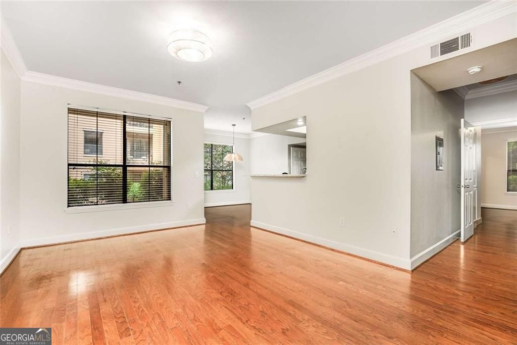 Buyers...this is the market you have been waiting for! Why keep renting when his beautiful 2/2 condo with comfortable, step free living is yours to be had? It features an open living floorplan and split bedrooms, with the second bedroom being ideal for roommates, house guests or your home office. The primary suite offers a large walk-in closet plus a second closet, as well as a dual vanity bathroom, two rare perks you won't find often in the community. This unit also includes two covered, deeded parking spaces, side by side and on the same level as the condo, making coming and going smooth and easy; no lugging groceries up numerous flights of stairs over here. Take your morning coffee on your private patio, then later enjoy easy access to well-maintained community amenities such as a resort-style pool, fitness center, and clubhouse within a gated setting. Have a four legged friend? Taking them out couldn't be easier from your patio, plus they will also get to take advantage of the community perks with the newly turfed dog park. Located just minutes from Buckhead, Midtown, dining, shopping, and major highways, you'll be close to everything you love about the city. Affordable, move-in ready, and ideal for low-maintenance living. Schedule your private showing today, and ask about the buyers incentives our preferred lender has.