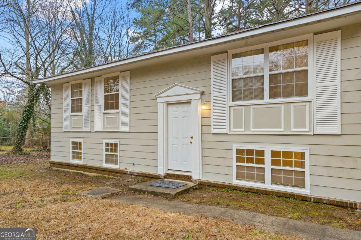 Charming Split-Level Home in Riverdale - Fully Renovated Basement! Welcome to this beautifully updated 5-bedroom, 2.5-bathroom split-level home in the heart of Riverdale, GA! Situated on a .26-acre lot, this 1,850 sq. ft. home offers modern upgrades while maintaining its classic charm. Step inside to find hardwood floors throughout the main level, leading to the kitchen featuring new granite countertops and ample cabinet space with abundant natural lighting with the large kitchen windows. The upstairs bathroom has also been upgraded with a new sink and cabinetry. The fully renovated basement provides extra living space, featuring two spacious bedrooms and one and a half bathrooms! Built in 1964, this home boasts solid construction while offering contemporary upgrades for today's lifestyle. Enjoy the convenience of a split-level design, giving you flexible living spaces and privacy. The spacious backyard is ideal for entertaining, gardening, or simply relaxing outdoors. Located in a quiet neighborhood less than 5 minutes away from Southern Regional Medical Center, shopping, dining, and major highways, this home is a must-see! Don't miss out on this move-in-ready gem-schedule your showing today!