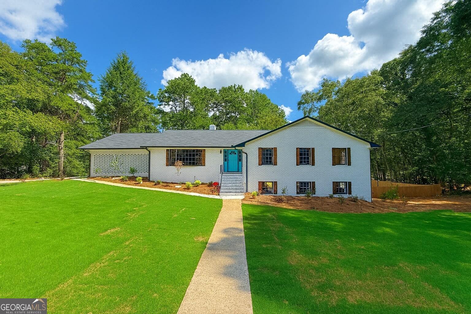 OPEN HOUSE NEXT SATURDAY & SUNDAY 11 - 12! Located in one of Athens' most desirable neighborhoods, this spacious brick home sits on one of the largest lots in the area. Inside, you'll find hardwood floors, oversized living spaces, and a fully finished basement with two built-in bars-perfect for entertaining. Upgrades include new roofing, brand-new electrical, two water heaters, and two laundry rooms for ultimate convenience. The carport even features an EV charger. Step outside to your private backyard oasis with a huge in-ground pool-ideal for summer fun and gatherings. With style, space, and smart upgrades, this home offers the best of family living and entertaining in the heart of town. The lot will be surveyed and divided into two lots. VIDEO TOUR AVAILABLE ON YOUTUBE BY TYPING IN THE ADDRESS!