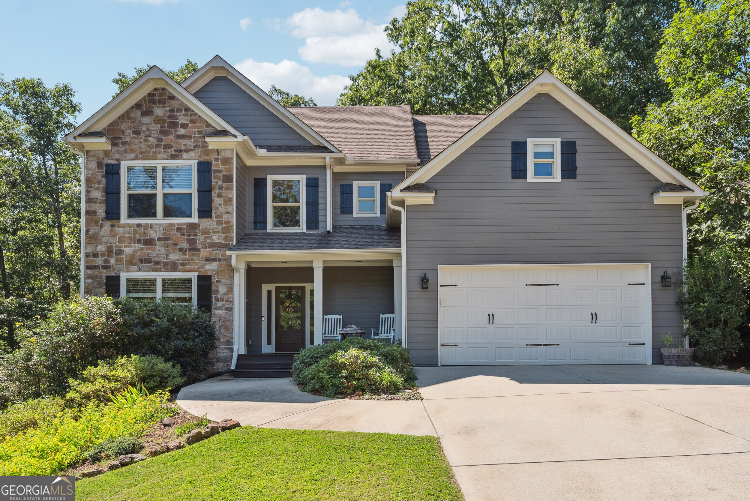 These 5 Br/4Ba homes with FINISHED BASEMENT has a PRIME LOCATION, only 5 MINUTES TO I-75 offering EXCEPTIONAL PRICE PER S.F. Conveniently located between Cartersville and Canton, this home has is in a highly sought after small, HOA protected neighborhood. The home will WOW you with unlimited upgrades, including extensive crown molding package, a soaring 2 story foyer, hardwoods throughout the main level. Kitchen boasts granite countertops, tile back splash, breakfast area, & is open to the family room. Separate dining room features tall crown molding, coffered ceiling & wainscoting. Upstairs features an oversized master suite w/ large walk-in closet. The Master bath has tile flooring, granite counter-tops, with travertine shower and soaking tub. Upstairs there are 2 bedrooms that share a full bath and a HUGE bonus/game room between the master and secondary bedrooms that is great for a kid's rec room. Bedroom w/ full bath on main level makes for a great office area. Lower level is FINISHED providing a 5th bedroom, 2nd family room and full bath. This is the perfect teen/in-law suite or place for family to visit. Screened-in porch overlooks the private fenced back yard with room for the kids to play and a firepit area. Tile flooring and granite in all baths. This home has been meticulous maintained and no carpet. All hardwoods or LVP. Irrigation system in front yard.