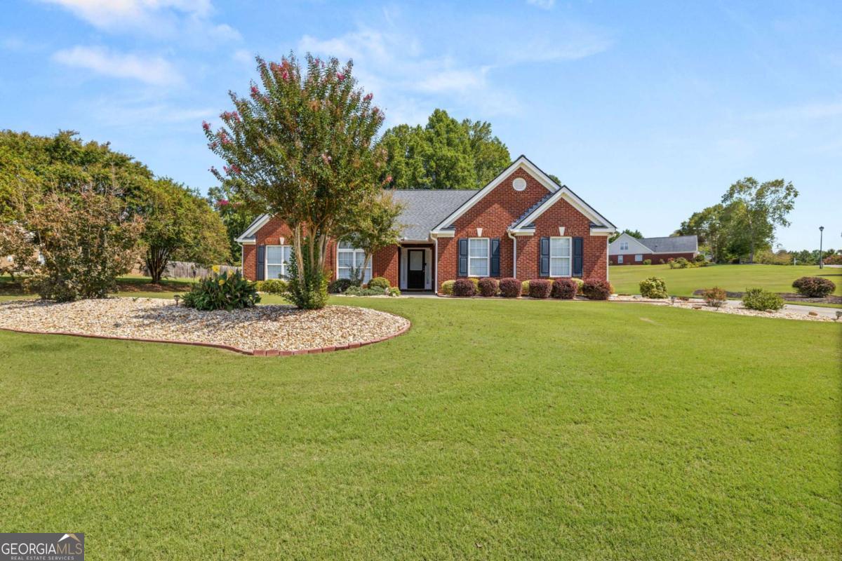 Charming 4-Sided Brick Ranch in Jefferson. Welcome to this beautifully maintained 4 bedroom, 2 bathroom ranch-style home in the heart of Jefferson, Georgia! This 4 sided brick gem offers timeless curb appeal with a professionally landscaped yard and a spacious above ground pool perfect for summer fun. Step inside to discover an open concept living and dining area with updated flooring that flows seamlessly throughout the main living spaces. The modern kitchen features granite countertops, stainless steel appliances, and plenty of cabinet space, ideal for both everyday meals and entertaining. The home's thoughtful layout includes generously sized bedrooms and stylishly updated bathrooms. Step outside on the .85 acre lot to enjoy a large patio, perfect for outdoor dining, gatherings, or simply relaxing by the pool. This move-in ready home is located in a desirable Jefferson neighborhood with easy access to schools, shopping, and parks. A one-year home warranty included for peace of mind. Don't miss your chance to own this turn-key property with both style and function! Schedule your private showing today! This one won't last long!