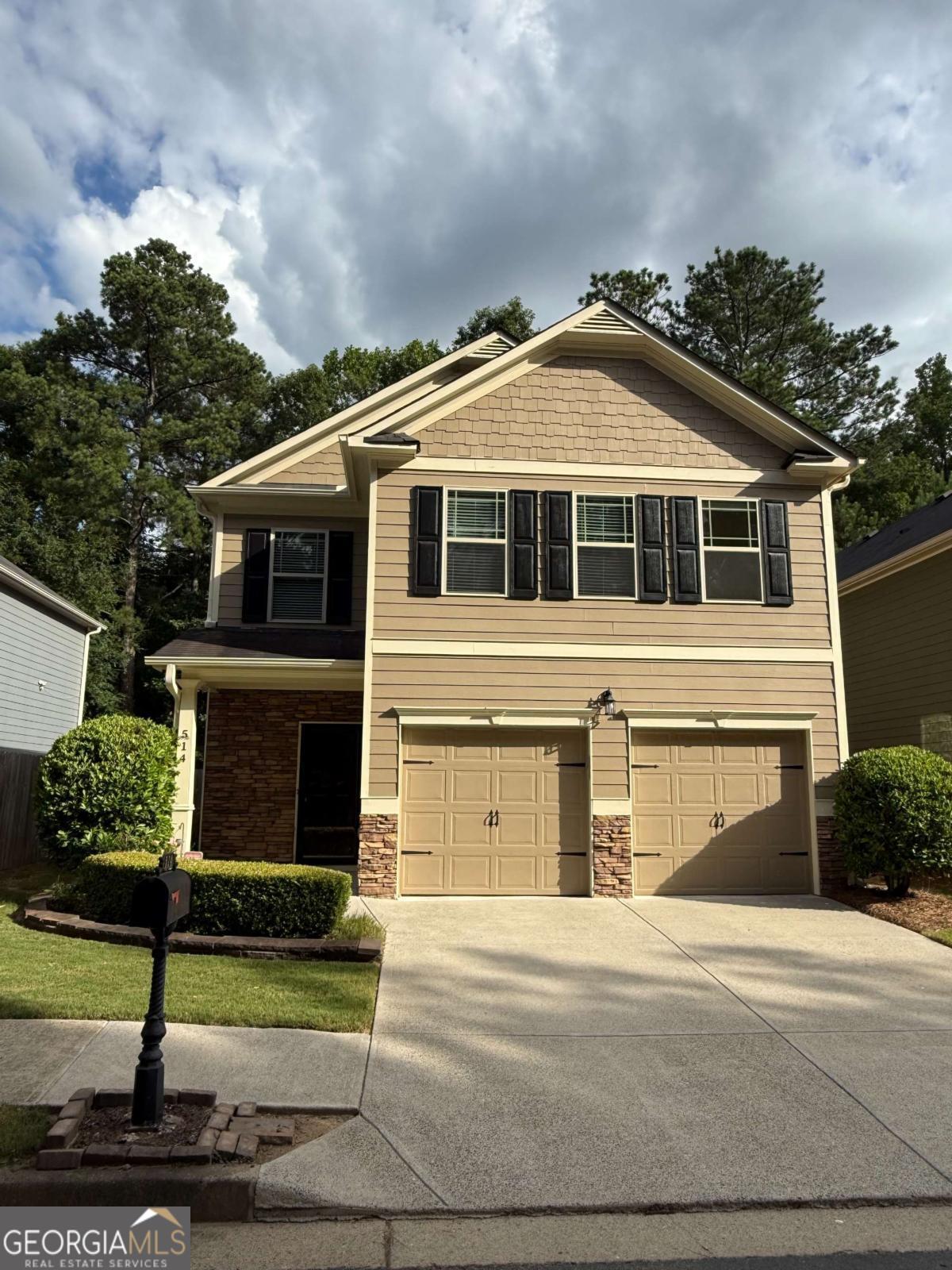 Located in the highly sought-after Woodstock school district, this inviting four-bedroom, two-and-a-half-bath home offers a warm blend of comfort and style, beginning with a two-story foyer that welcomes you inside. The spacious kitchen is the perfect place to gather with rich 42" stained cabinets, gleaming granite countertops, and a convenient passthrough window that frames a view into the cozy living room. The main living area is completed with an adjoining dining area, access to the backyard and garage, and a half bath. Upstairs, the serene master suite offers a private retreat complete with tray ceilings and an ensuite bath featuring a soaking tub, separate shower, and dual vanities. Three additional sunlit bedrooms and a second full bath provide ample space for family or guests. Just a short drive to downtown Woodstock's vibrant shops, restaurants, parks, walking trails and entertainment, and with an all-inclusive HOA that takes care of lanscaping and amenities, this home is a harmonious blend of modern living, natural charm and hassle-free lifestyle. This property won't be available for long... schedule your showing today!!