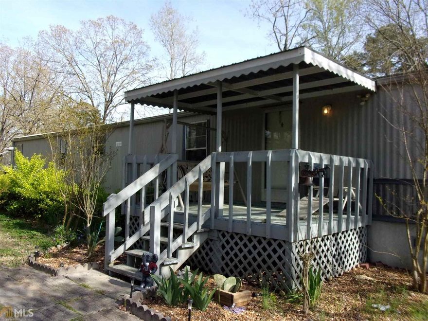 2 bedroom 2 bath mobile home just a short drive to Weiss Lake. You get the lake views and convenience with this affordable home. Nice level lot with 3 outbuildings. Room to park the boat or jets ski's or both. Public boat launch just a short drive from property. Call for your appointment today.