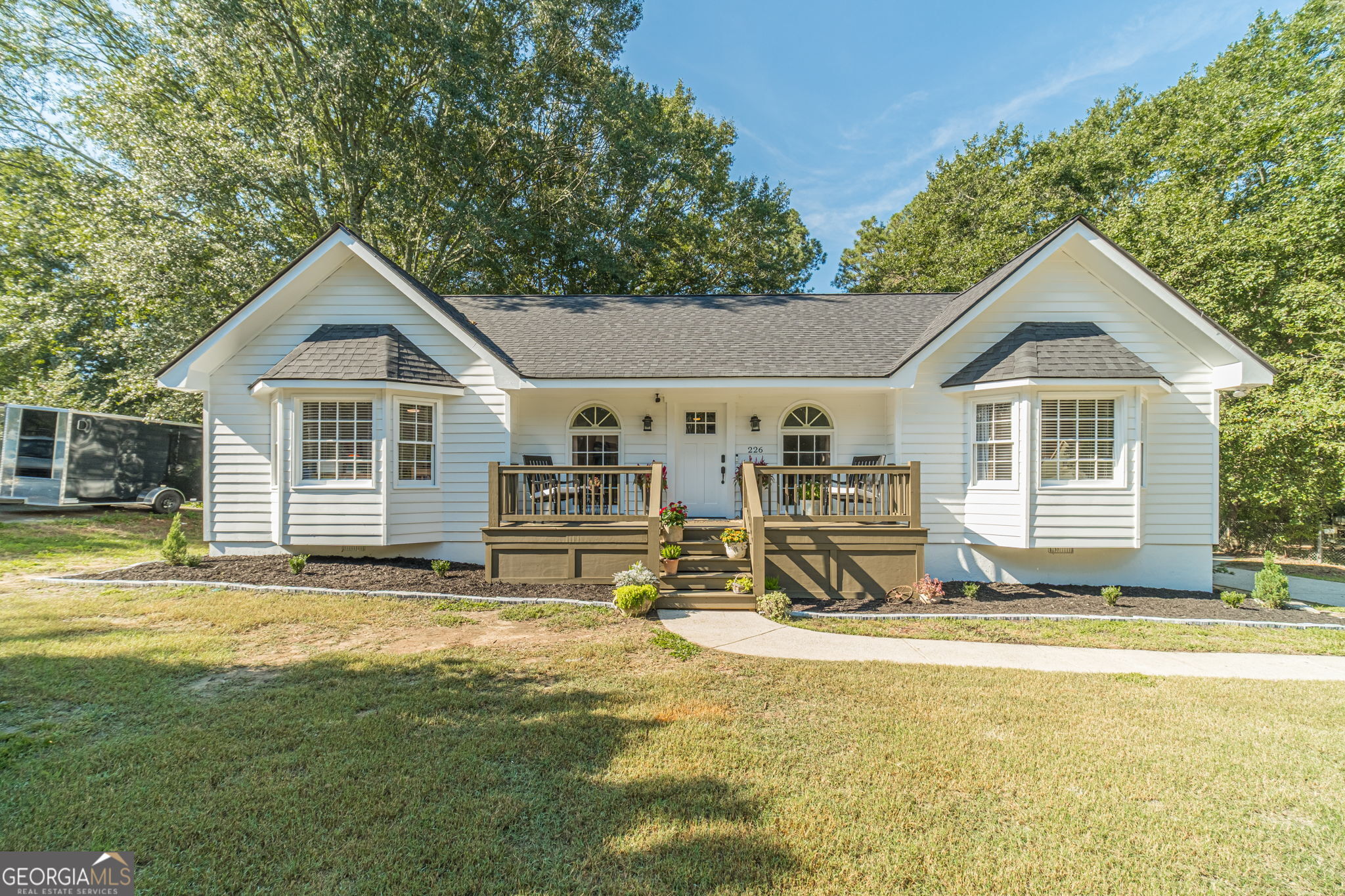 Charming Renovated Ranch with Modern Upgrades - Move-In Ready! Welcome to 226 Ryan Rd, a beautifully updated 3-bedroom, 2-bath ranch home in a quiet Winder neighborhood. This well-maintained property offers the perfect blend of classic charm and modern comfort, with major upgrades already completed for peace of mind. Step onto the inviting front porch and into a freshly painted interior that feels bright, open, and welcoming. The spacious living area flows seamlessly into the dining and kitchen spaces perfect for everyday living and entertaining. Enjoy cooking in a functional kitchen, then step outside to a large back deck ideal for grilling, relaxing, or hosting guests. Major Updates Include: New Roof (2024) New HVAC System (2025) Bathroom and Laundry Room Renovated (2022) All-New Water Pipes (2020) Fresh Interior & Exterior Paint (2025) This home also features a split-bedroom floor plan for added privacy, a generous 0.41-acre lot, and a detached 2-car garage offering extra storage or workspace options. Located minutes from schools, shopping, and major highways (I-85 and GA-316), this home offers the perfect mix of tranquility and convenience. Beautiful Bronze gutters will be installed on Monday 09/15. Don't miss this move-in ready gem with all the big-ticket items already done schedule your showing today! Stop by Open House Saturday 9/13 from 12:00p.m.-2:00 p.m!