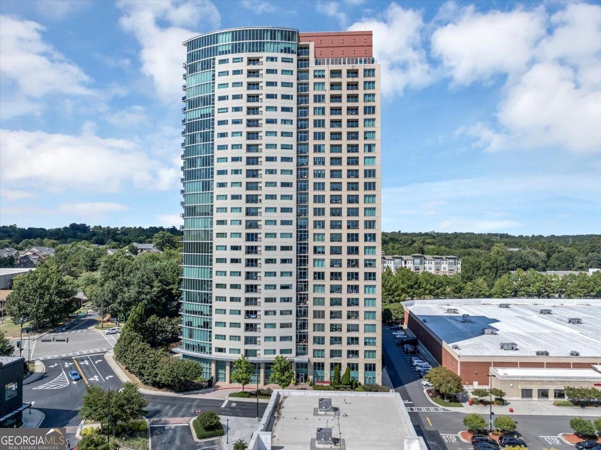 BEAUTIFUL HIGHRISE LISTING! and 2 Extra storage units. Live above it all in this stunning 27th-floor residence offering panoramic skyline views, luxurious finishes, and unparalleled convenience. Perfectly situated in the heart of Dunwoody, this modern condominium combines sophisticated design with resort-style amenities. This unit is clean and smoke free. Property Features: * Curved Floor-to-Ceiling Windows in living & dining areas - breathtaking natural light and dramatic city views * Hardwood Floors Throughout (carpet only in bedrooms for comfort * Upgraded Kitchen - Outfitted with premium cabinets and high-end finishes, ideal for everyday living and entertaining with upper & lower counter lighting for stunning evening ambience * Separate Dining Area - A spacious, elegant setting for hosting dinners or gatherings. * Custom Storage - California Closets in every closet for maximum organization and efficiency. * 2 Assigned Parking Spaces + 2 Storage Units - Rare and highly desirable features offering convenience and peace of mind. * Open-Concept Living - Floor-to-ceiling windows flood the home with natural light and showcase sweeping city views. Resort-Style Amenities: * State-of-the-art fitness center * Heated swimming pool * Dog park conveniently located on the 8th floor * Tennis court and pickleballs area for active living * Bar-style grill area perfect for entertaining outdoors * Spacious, elegant clubhouse for hosting events and social gatherings * 27th-Floor Skyline Views | Perfect backdrop for morning yoga, breathtaking sunrises, and relaxing sunset evenings * Convenience Perks: On-site dry cleaning delivery service Community & Location: * Walkable to Dunwoody's premier shops, restaurants, and entertainment. * Easy access to MARTA and major highways for a seamless commute. * Secure, luxury building with 24 concierge services and a vibrant community atmosphere. This condominium offers the perfect balance of city living and private retreat, complete with luxurious upgrades, rare extras like two parking spaces and storage units, and one of the best amenity packages in Dunwoody.