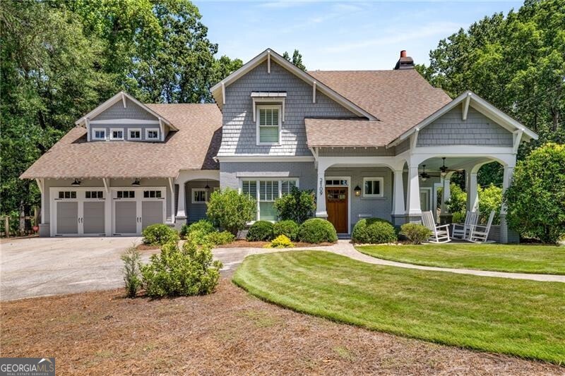 This stunning custom-built home is a masterpiece of modern luxury and timeless design, nestled on a private, wooded lot just under an acre. The architecture seamlessly blends elegance with functionality, featuring thoughtful window designs that frame serene views of your private sanctuary. Upon entering, you're greeted by open concept living and high-end finishes throughout. The heart of the home is the chef's kitchen, equipped with top-of-the-line appliances, walk in pantry, custom cabinetry, granite counter tops, and a 9.5 foot marble island perfect for entertaining. Adjacent to the kitchen, the dining area flows effortlessly into the living room, where a statement wood burning/gas fireplace and custom built-in cabinetry adds warmth and sophistication. The primary suite, conveniently located on the main level, serves as a private retreat with its spa-like ensuite bath, featuring a walk-in shower, heated floors, and dual, marble vanities. A generous walk-in custom closet in all bedrooms provides abundant storage and organization. Other features include ample parking along the private driveway for visitors. Additional features include walk-up attic for storage, Icynene spray foam insulation, whole house water filtration system, secret door to playroom, Hot water recirculating pump = fast hot water to all faucets, and a reading nook with bookshelves. Step outside to a breathtaking outdoor living space, designed for both relaxation and entertaining. The back covered patio, with alfresco dining area, overlooks a sparkling 18 x 32 saltwater pool with automatic electric pool cover, spa and sun-shelf, creating an oasis-like atmosphere. Lounge by the water's edge or gather around the custom-built fire pit to enjoy the fully landscaped yard with irrigation system. With meticulous craftsmanship, thoughtful design, and a picturesque backdrop, this home offers a perfect balance of luxury, comfort, and privacy.