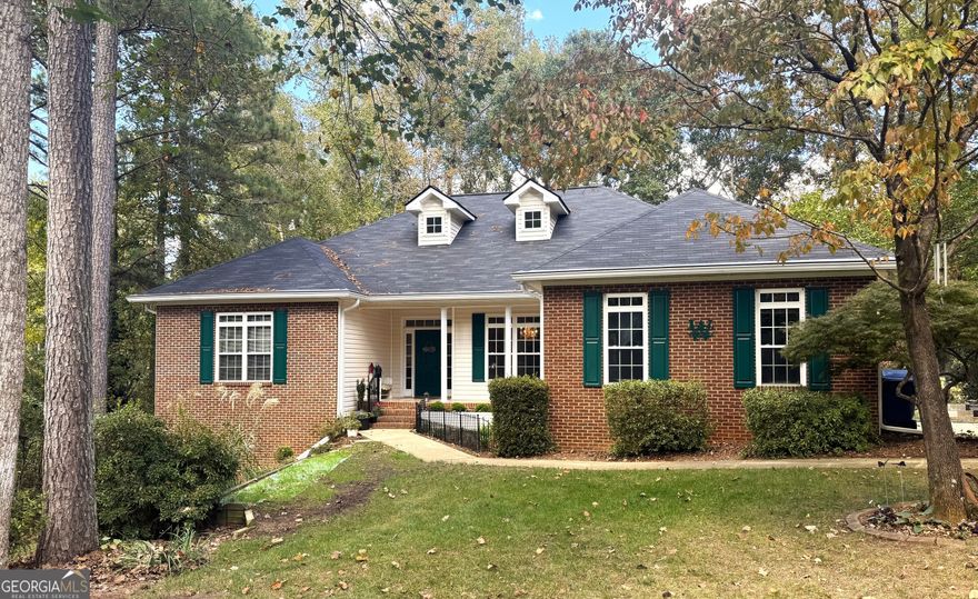 Looking for the perfect home in Oconee County? This beautifully maintained 5BR/3BA brick ranch sits on 2.5 acres in the desirable Estates at Calls Creek-a swim/tennis neighborhood in a top-rated school district.  The open-concept kitchen with new countertops and pantry flows into the family room with fireplace and tray ceilings, plus a formal dining room.  The spacious primary suite offers a Jacuzzi tub, separate shower, and generous layout. Three additional bedrooms and a full bath complete the main level, along with a built-in central vacuum.  The finished walkout basement adds flexibility with a bedroom, full bath, family room, exercise area, laundry, dry bar, and storage-ideal for guests or multi-generational living.  Enjoy outdoor living on the deck or screened porch with hot tub overlooking a private landscape, plus two utility sheds.  Minutes to Wire Park, Downtown Watkinsville, and Thomas Preserve. A gem blending location, lifestyle, and livability!