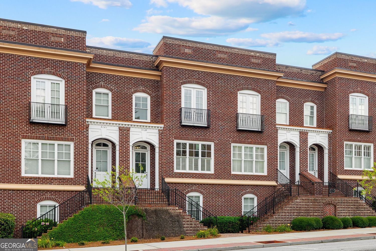 Stunning 3BR/3.5BA Brownstone in the Heart of Chamblee! This beautifully updated brownstone townhome offers modern living with timeless elegance. Freshly painted throughout, this home features new light fixtures, updated kitchen with stylish backsplash, touch faucet and new stainless steel appliances, making it perfect for both everyday living and entertaining. The main level boasts soaring 10-foot ceilings and refinished hardwood floors, creating a bright and airy atmosphere. The gourmet kitchen has been fully reimagined and is located to allow for entertaining and daily living with an open flow into the dining and living spaces. The oversized primary suite offers a private sitting or office nook, a generous walk-in closet, and a luxurious en-suite bath with a double vanity and separate soaking tub. The terrace level has been thoughtfully designed with a new foyer and includes a bedroom and full bath-ideal for guests, a home office, or a private retreat. From the spacious living room with fireplace and built-in shelving, step out onto the Trex deck off the main level and enjoy peaceful, tree-lined views, perfect for morning coffee or evening relaxation. Additional highlights include an attached 2-car garage, ample guest parking, and a sought-after location just steps from the Chamblee city center, Rail Trail, Whole Foods, Marta, local shops, restaurants, and breweries. You'll be just minutes away from Keswick Park, offering walking trails, sports courts, and more for outdoor enthusiasts. This home offers luxury, comfort and convenience in a gorgeous urban setting, making it the perfect place to call home. Don't miss out-schedule your showing today!