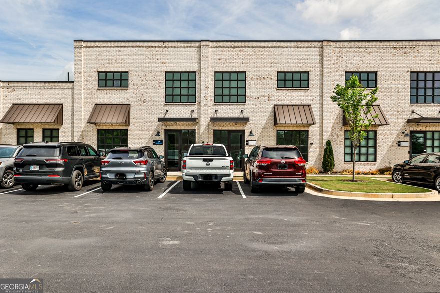 This beautifully renovated 1,800-square-foot office condo offers an ideal layout for productivity and comfort. Soaring high ceilings and abundant natural light create an inspiring work environment, while the modern interior is completely brand new-ready for immediate occupancy.    Located just off Hwy 9 in South Forsyth County, this space provides excellent access for clients and employees alike. The flexible floor plan is perfect for professional offices, creative studios, or growing businesses looking for a polished and functional space.    Don't miss this opportunity to own a light-filled, turnkey office in one of Forsyth's fastest-growing corridors.