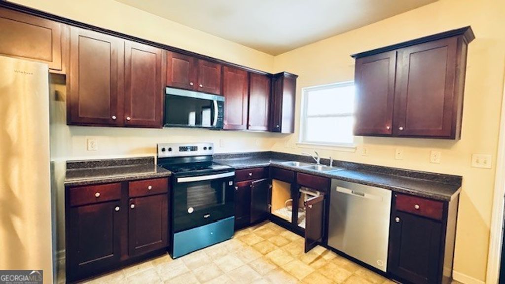 Photo of 606 Grenier Terrace, Lawrenceville, GA 30045 (MLS # 10684657)